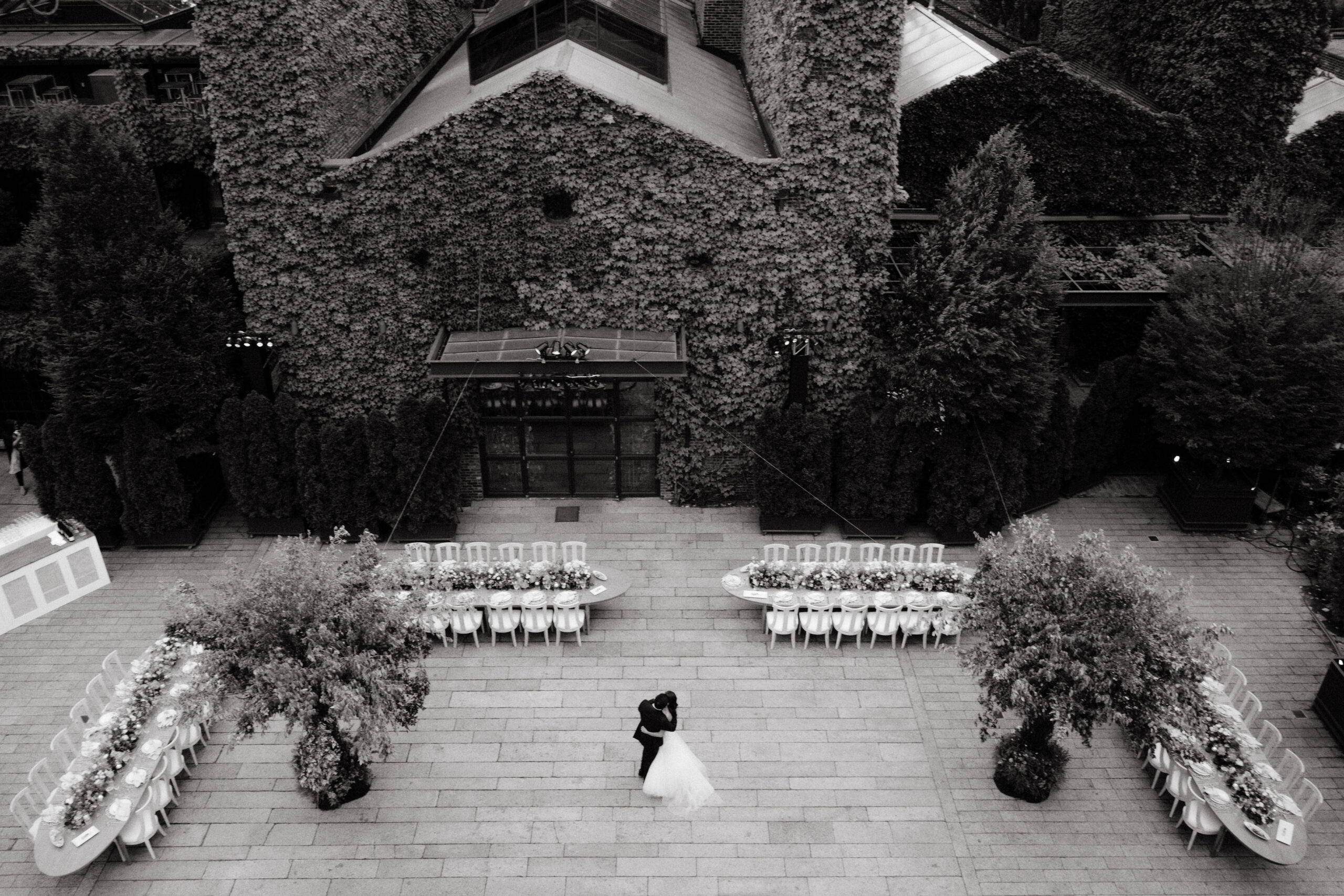 Top view, black and white image of the wedding couple hugging at The Foundry, NYC. Image by Jenny Fu Studio