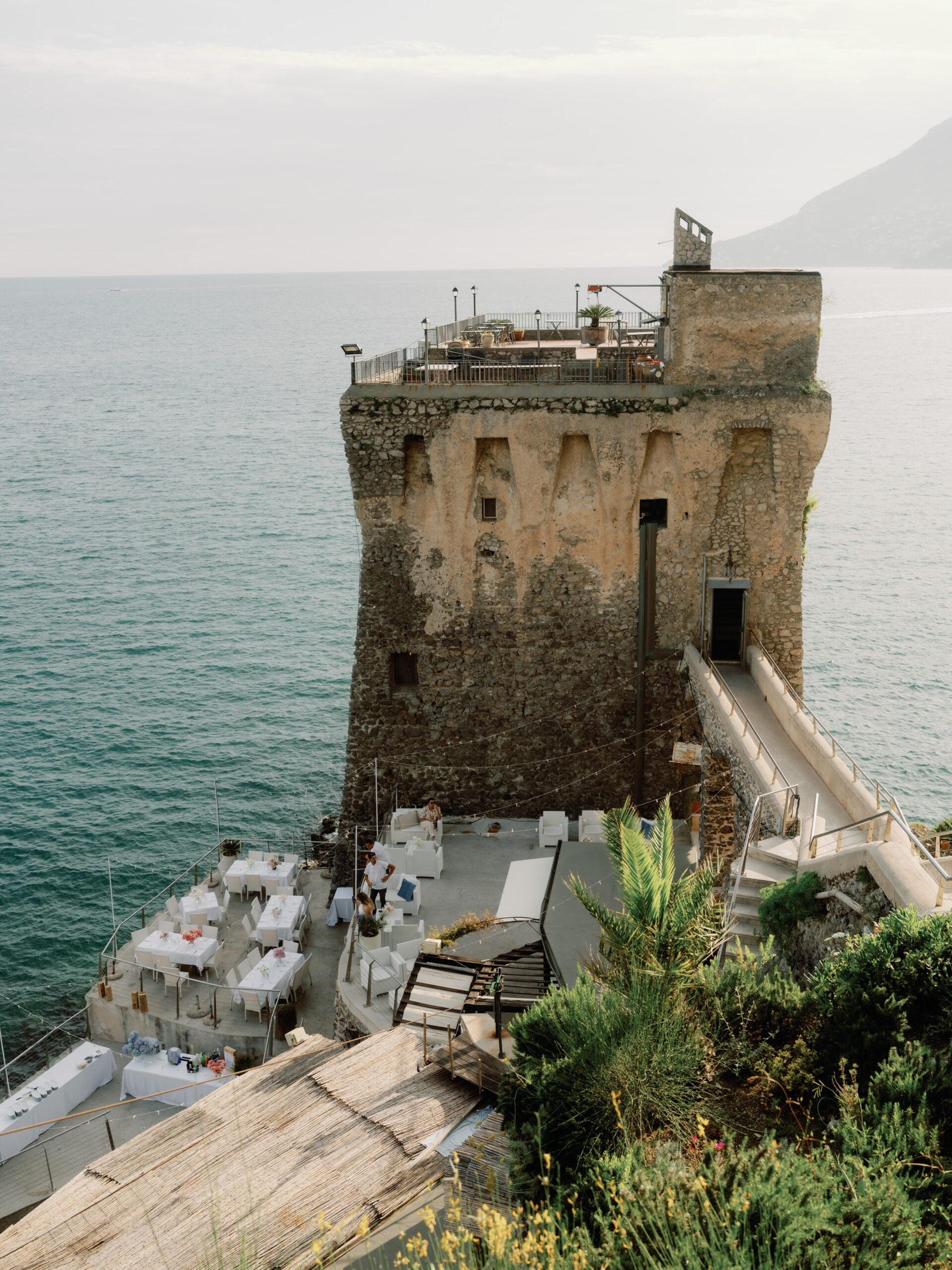 A medieval villa perched on a mountain, overlooking the Amalfi coast. Destination wedding in Italy image by Jenny Fu Studio.