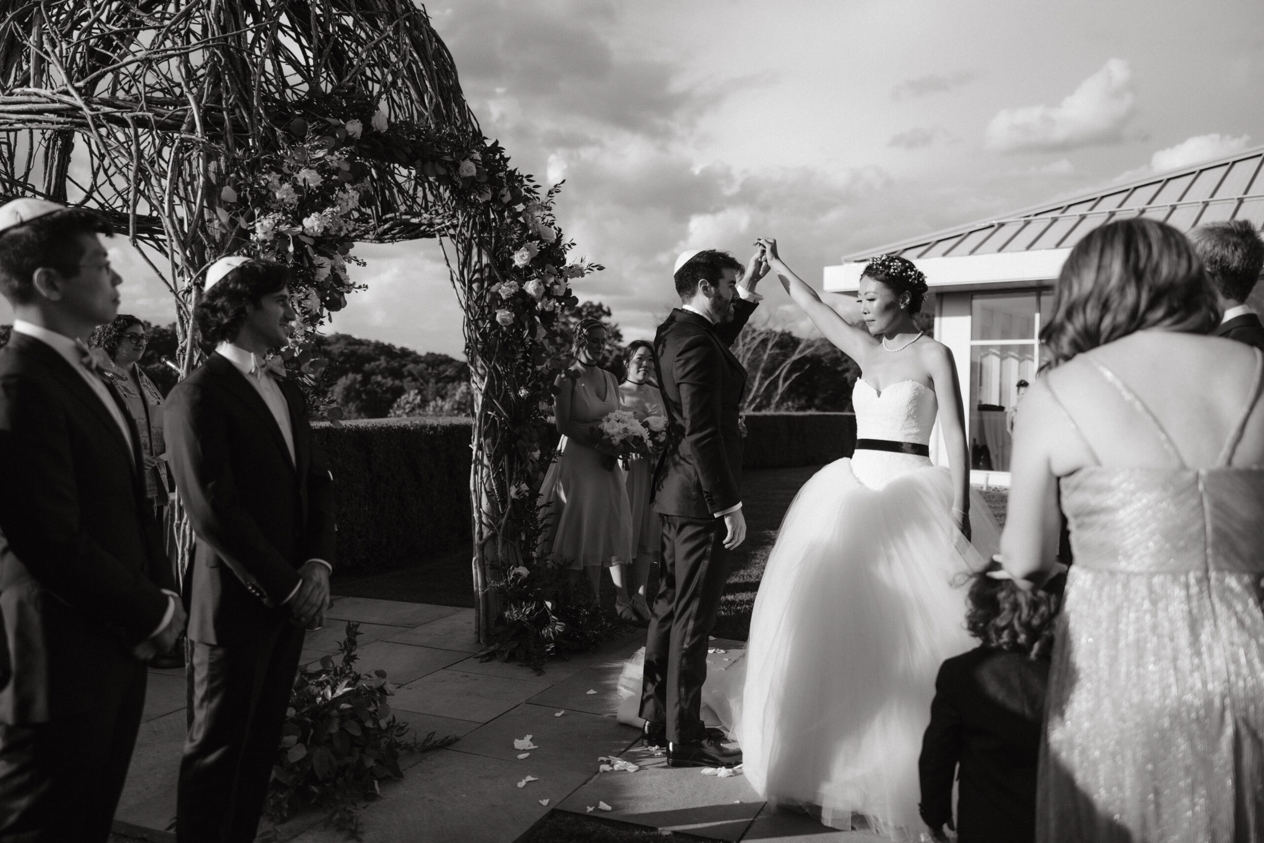 Wedding ceremony outdoors. Black and white wedding photography image by Jenny Fu Studio