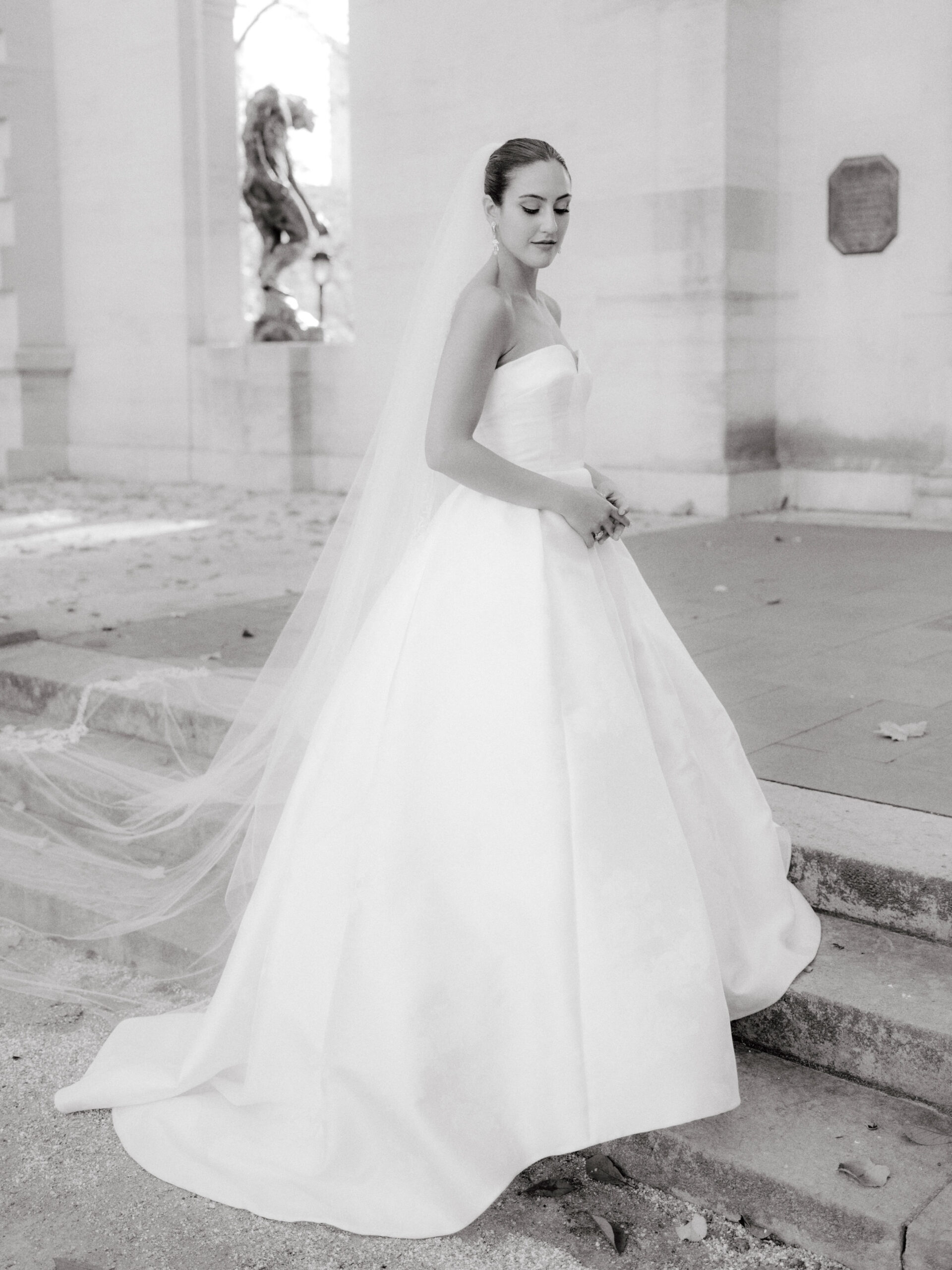 A beautiful bridal portrait with fine architecture in the background by Jenny Fu Studio.