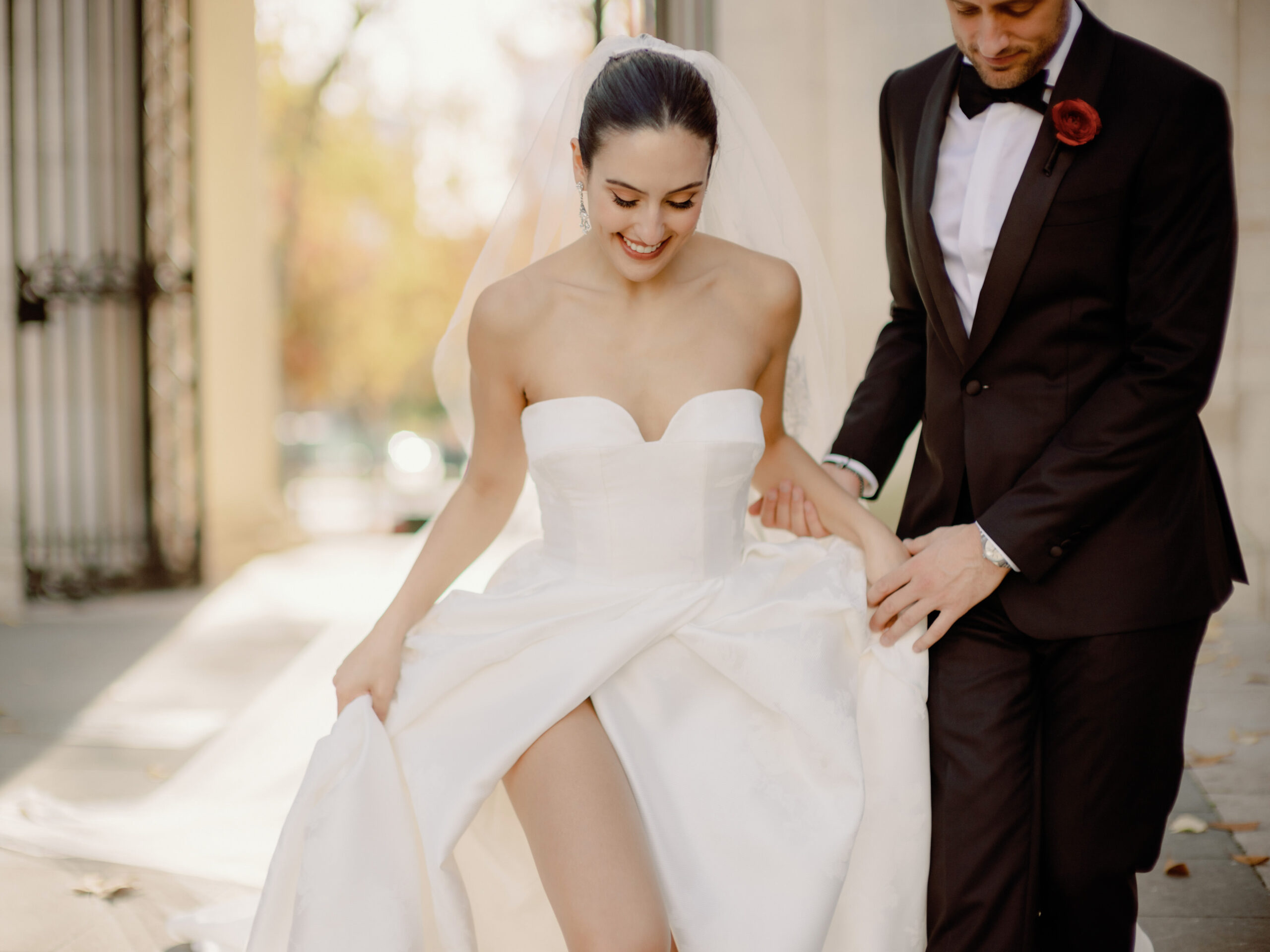 Editorial photo of the sexy bride, happily walking with her groom. Chic celebration image by Jenny Fu Studio
