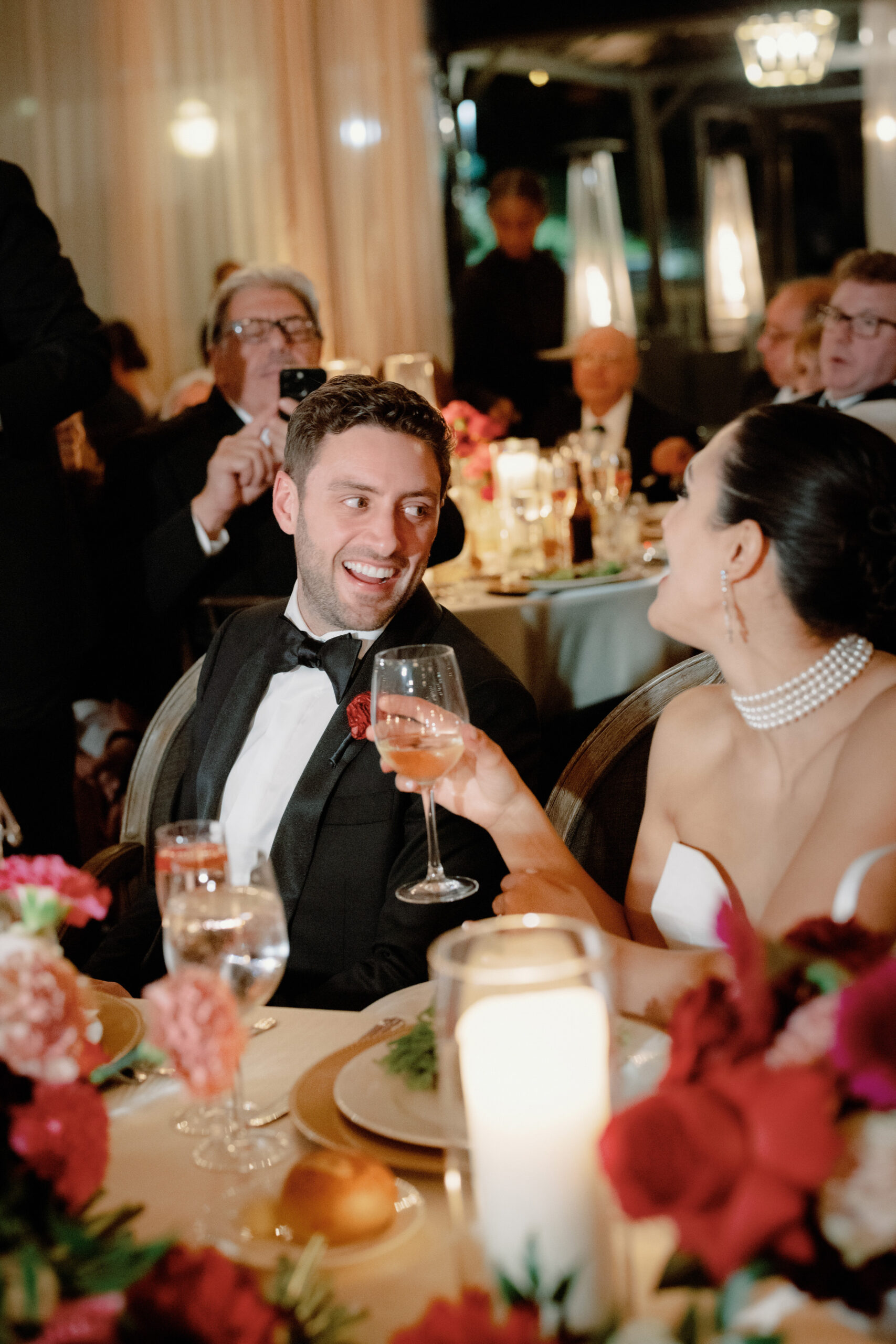 Candid photo of the newlyweds having a fun time in their reception party. Image by Jenny Fu Studio