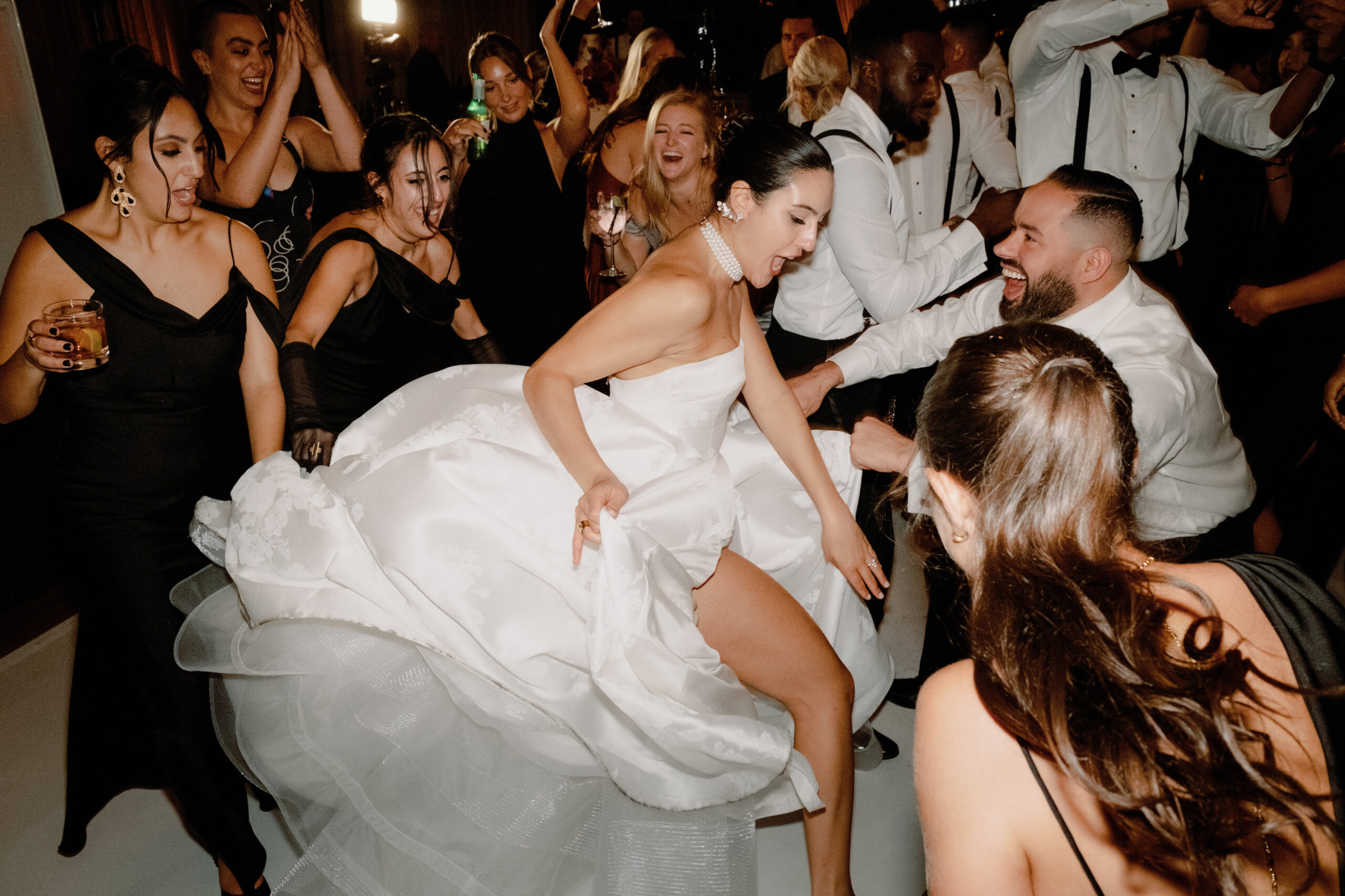 The bride and guests are so lively dancing on the dance floor. Image by Jenny Fu Studio 