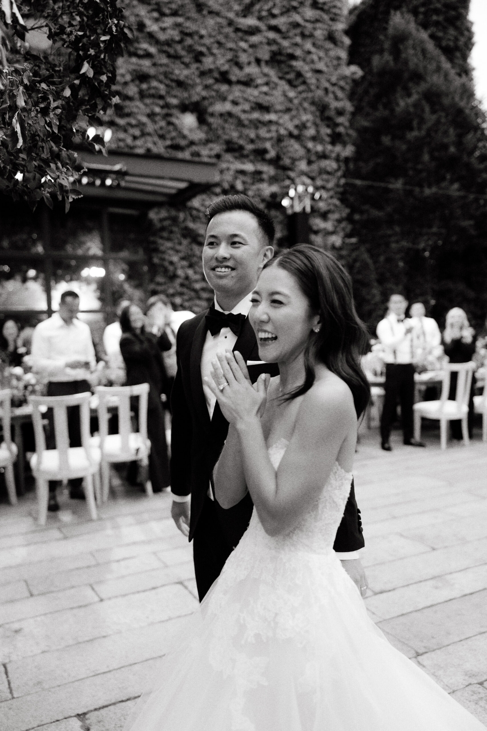 Black and white, candid photo of the bride and groom having fun in the reception area at The Foundry, NY.