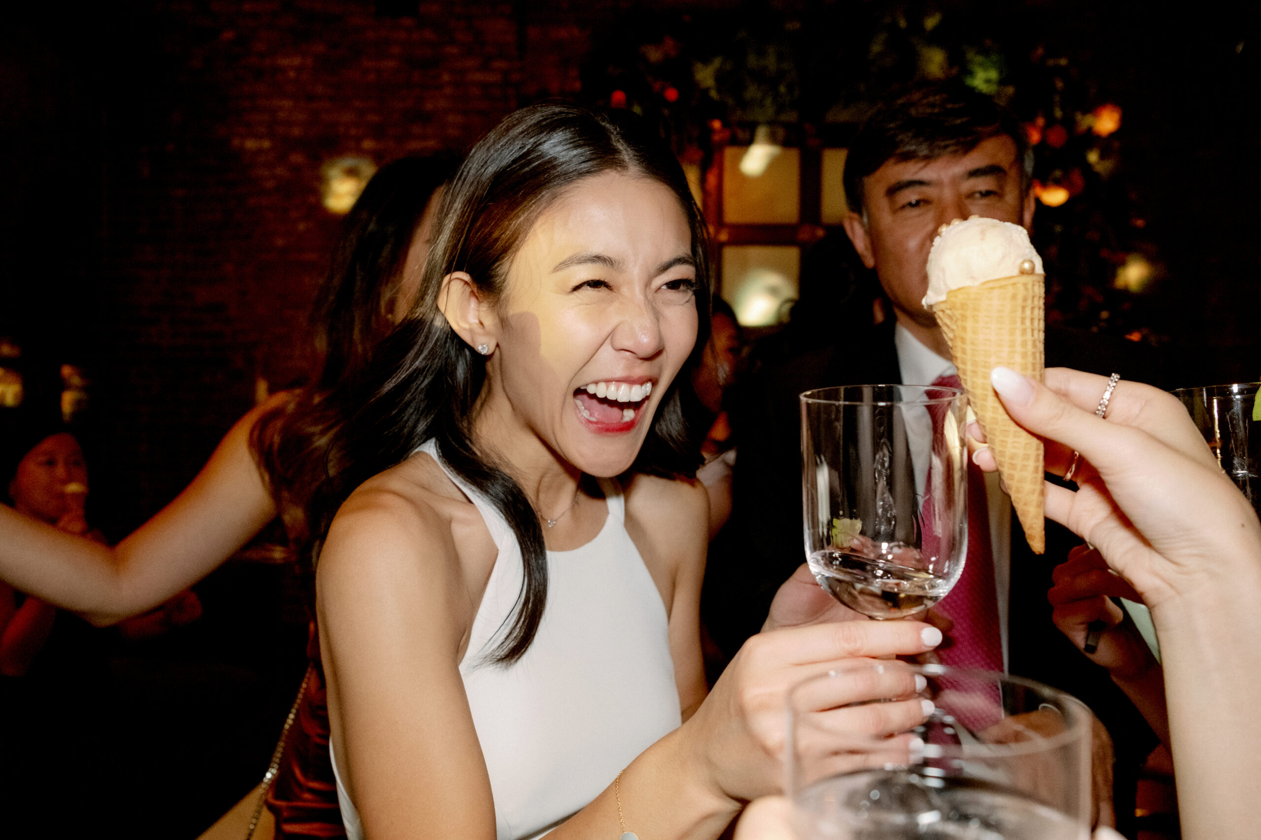 Editorial, candid photo of the bride having fun on the dance floor. Candid moments image by Jenny Fu Studio