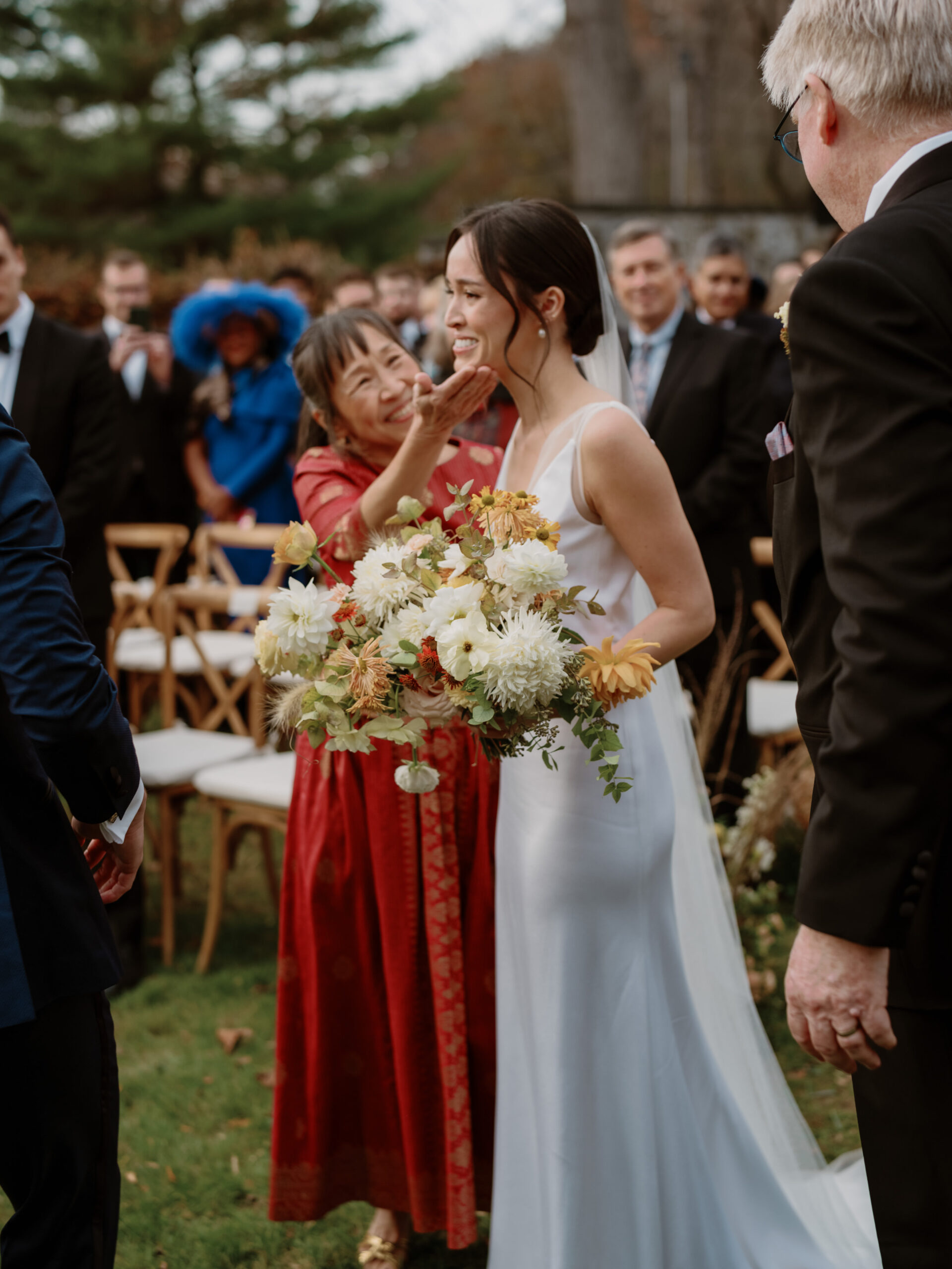 The bride is emotional as she walks down the aisle. Photojournalistic wedding photography image by Jenny Fu Studio