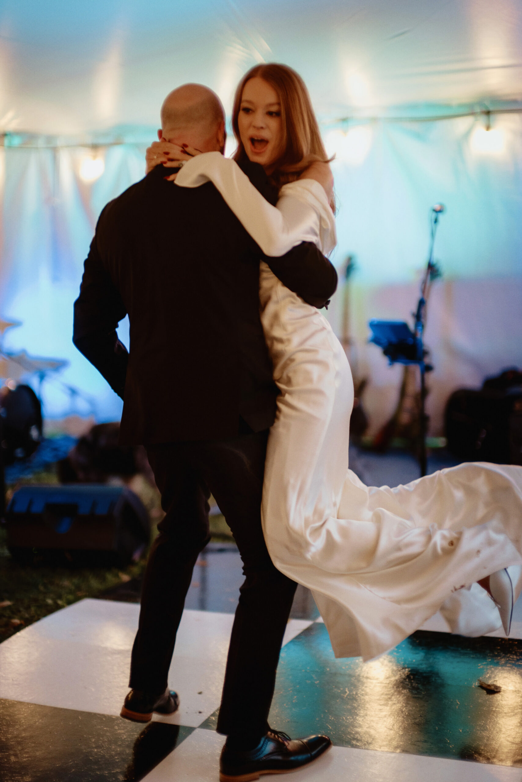 The groom is carrying the bride on the dance floor. Image by Jenny Fu Studio