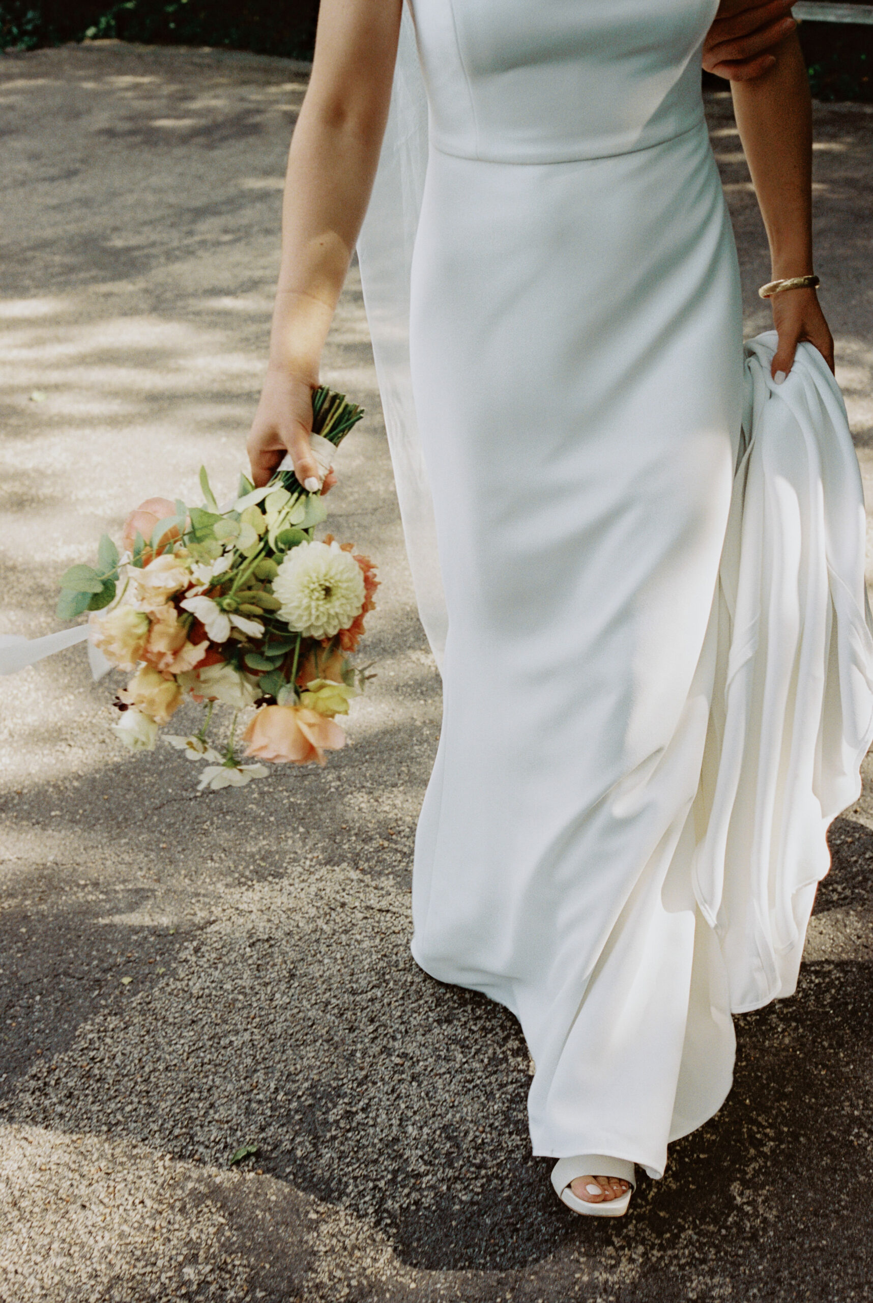 Editorial lower body photo of the bride while walking. Image by Jenny Fu Studio