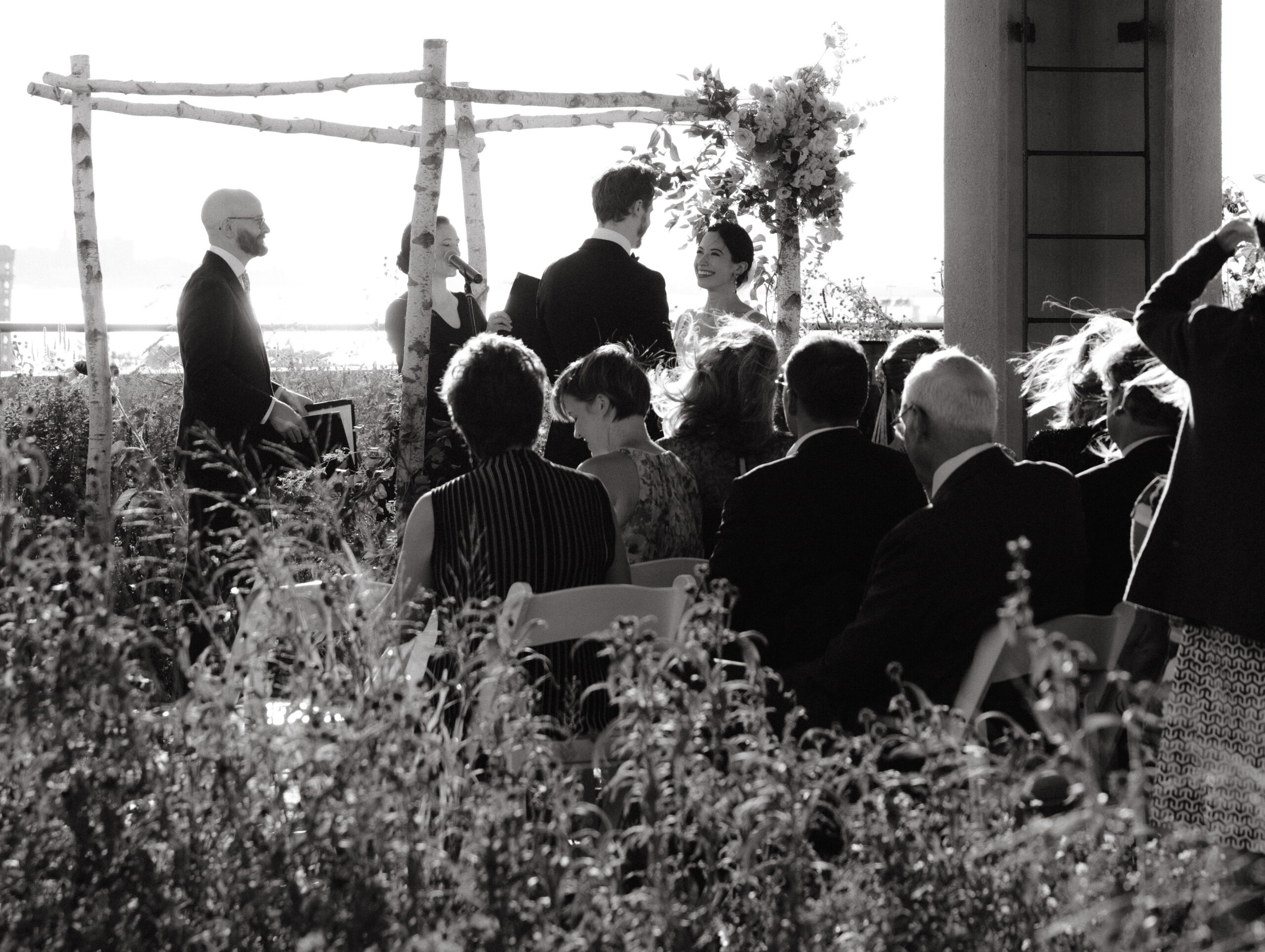 Black and white documentary wedding photography image of the wedding ceremony. Photo by Jenny Fu Studio. 