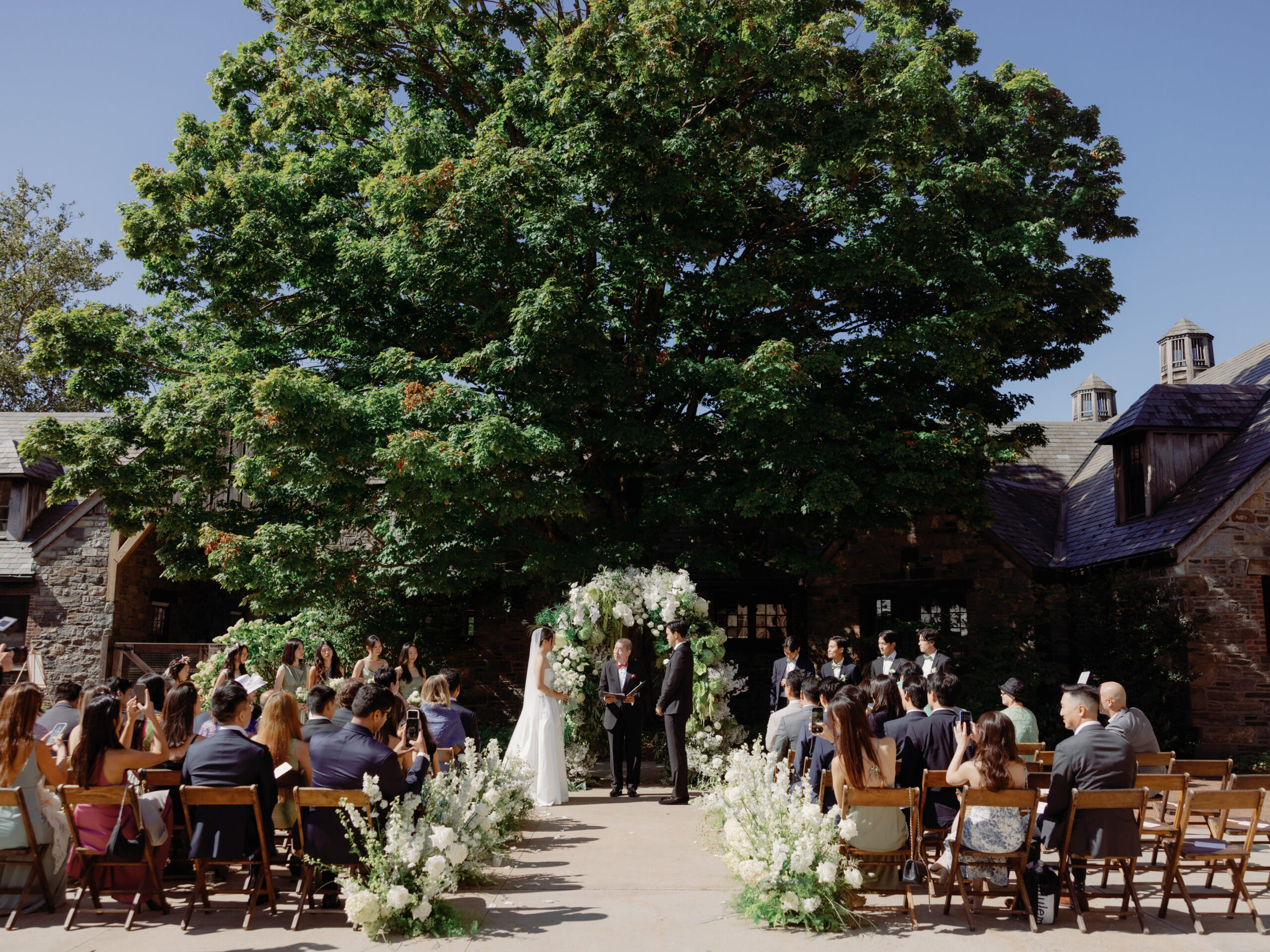 An outdoor wedding ceremony image at Blue Hill at Stone Barns, NY. Candid wedding photography image by Jenny Fu Studio