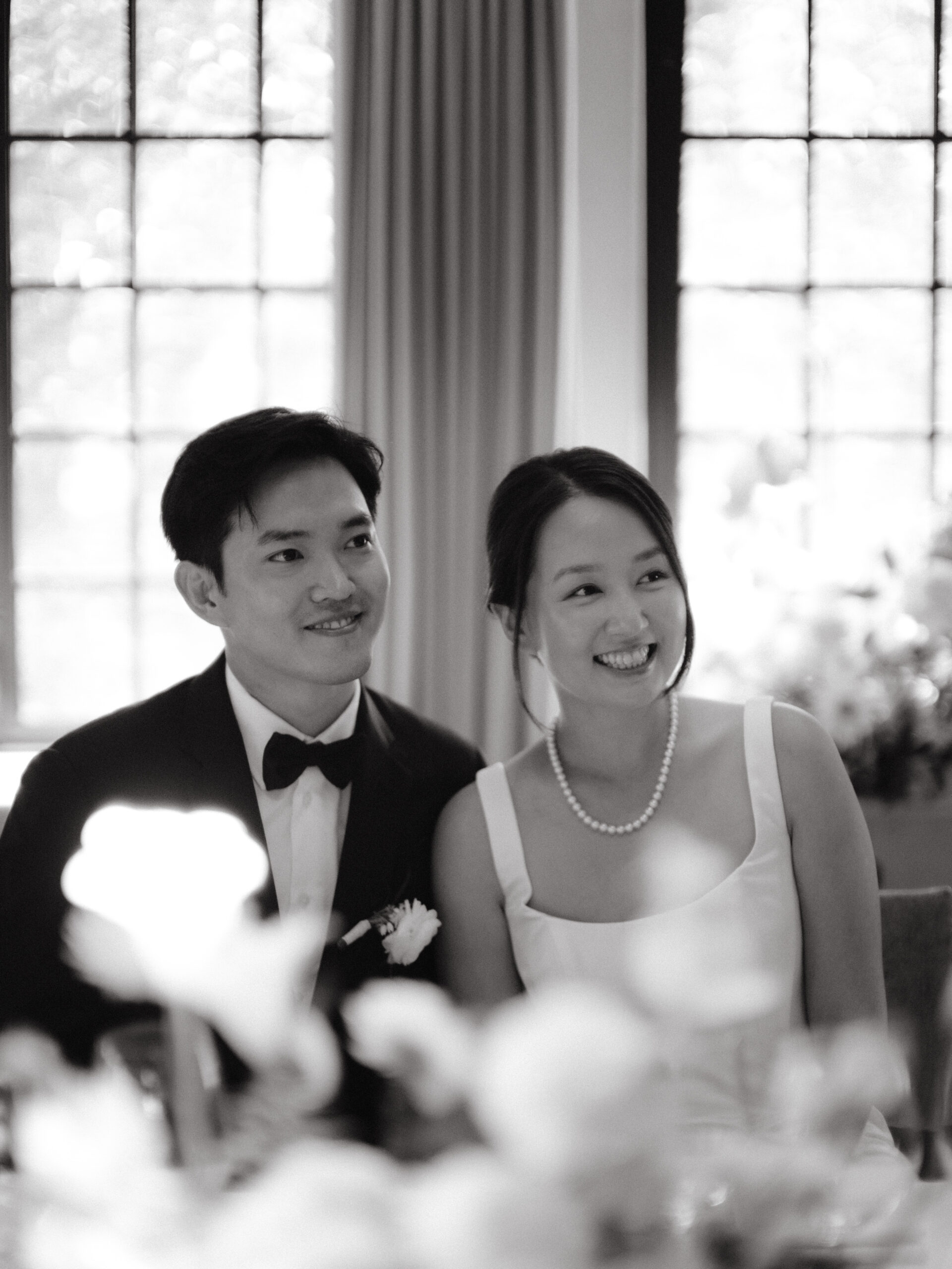 Candid wedding photography image of the happy newlyweds in the wedding reception by Jenny Fu Studio
