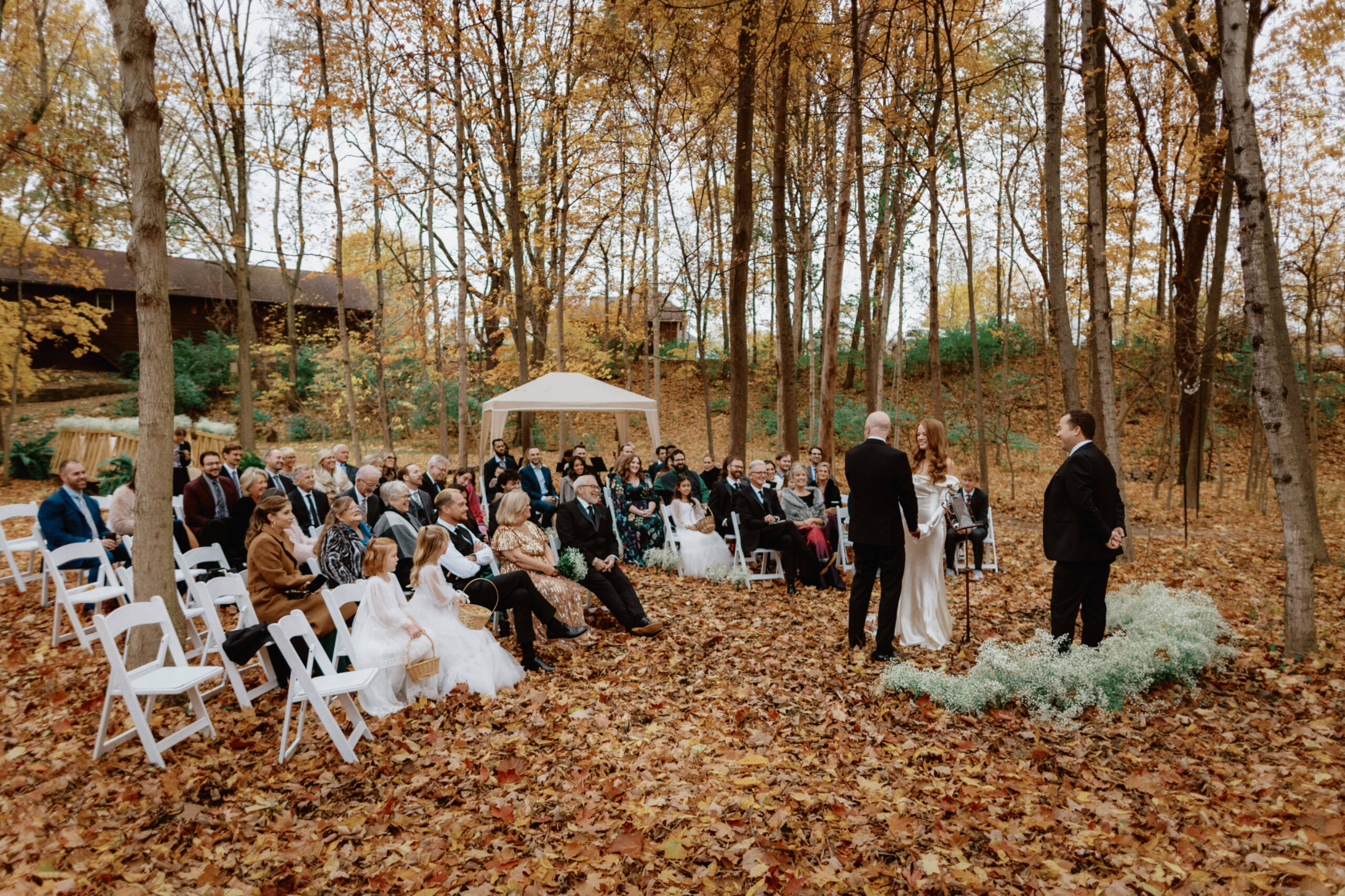Wedding ceremony outdoors in autumn. Unposed wedding photos by Jenny Fu Studio 