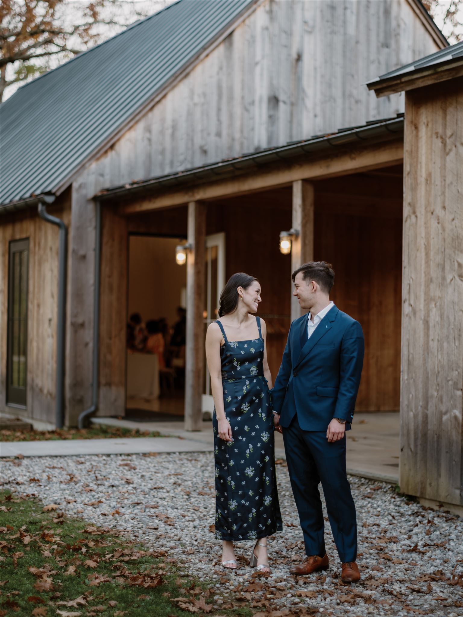 The soon to be wedded couple exchange sweet glances at each other at their welcome dinner venue. Image by Jenny Fu Studio