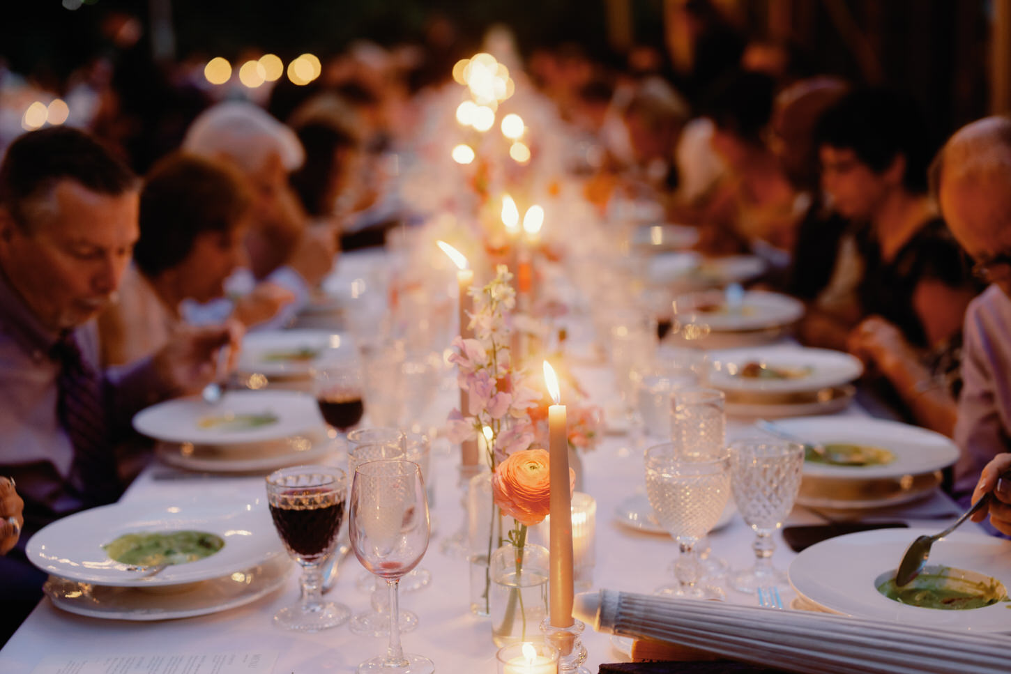 An elegant candle-lit wedding reception dinner shot by Jenny Fu Studio.