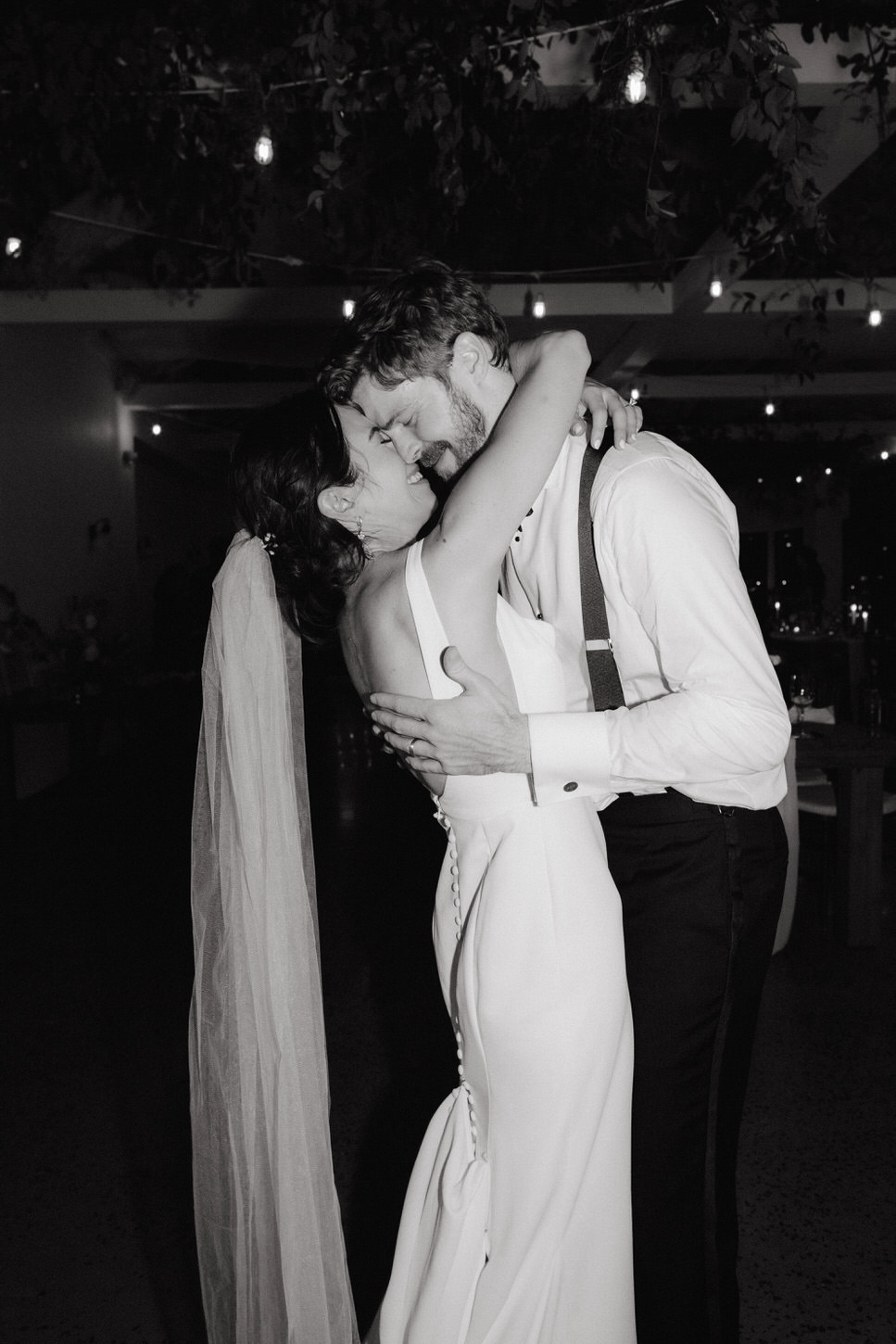 The bride and groom are dancing emotionally, with eyes closed and heads touching each other. Image by Jenny Fu Studio