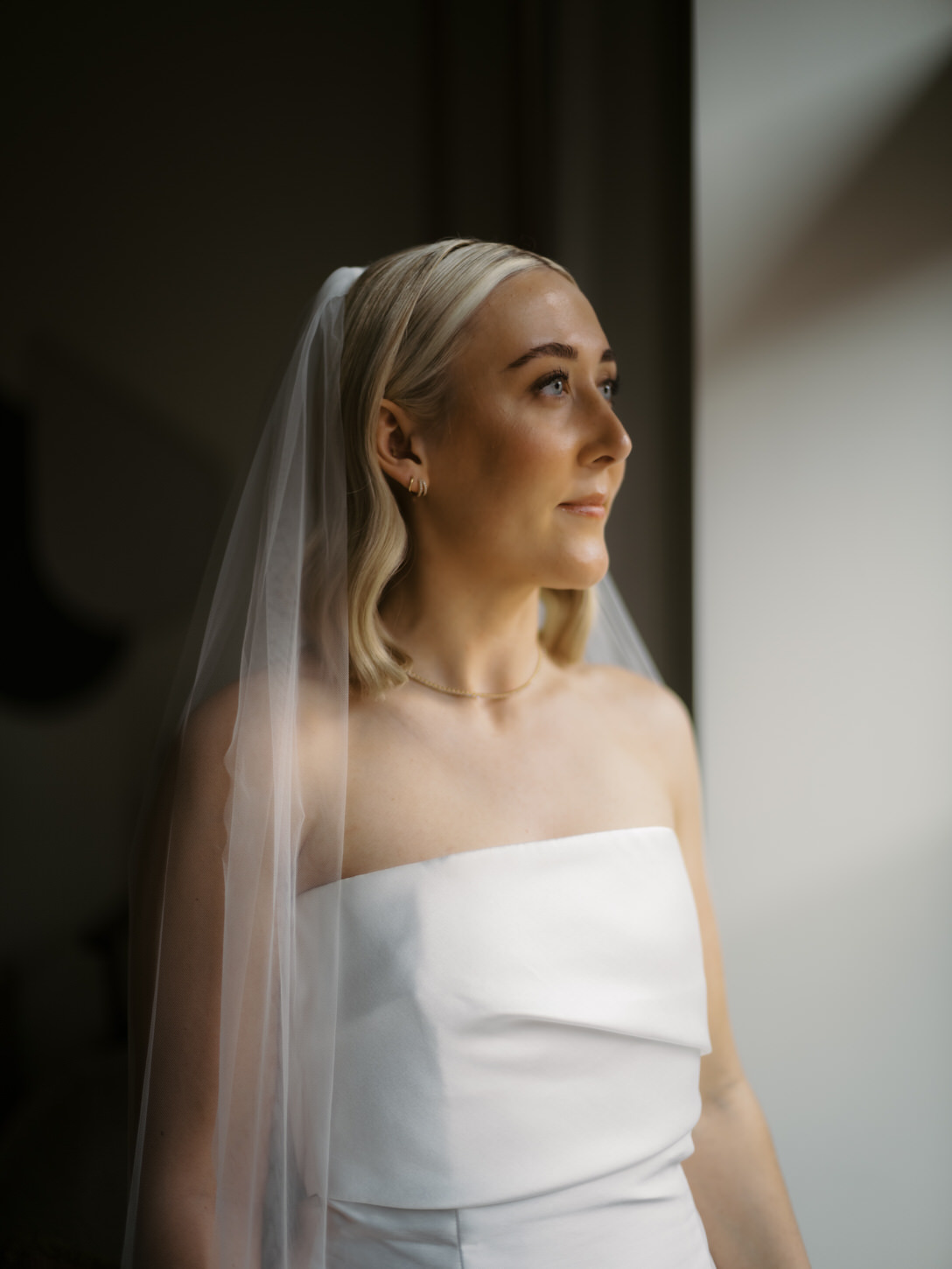 A getting-ready portrait of the bride for her elopement in NYC captured perfectly by Jenny Fu Studio's lenses.