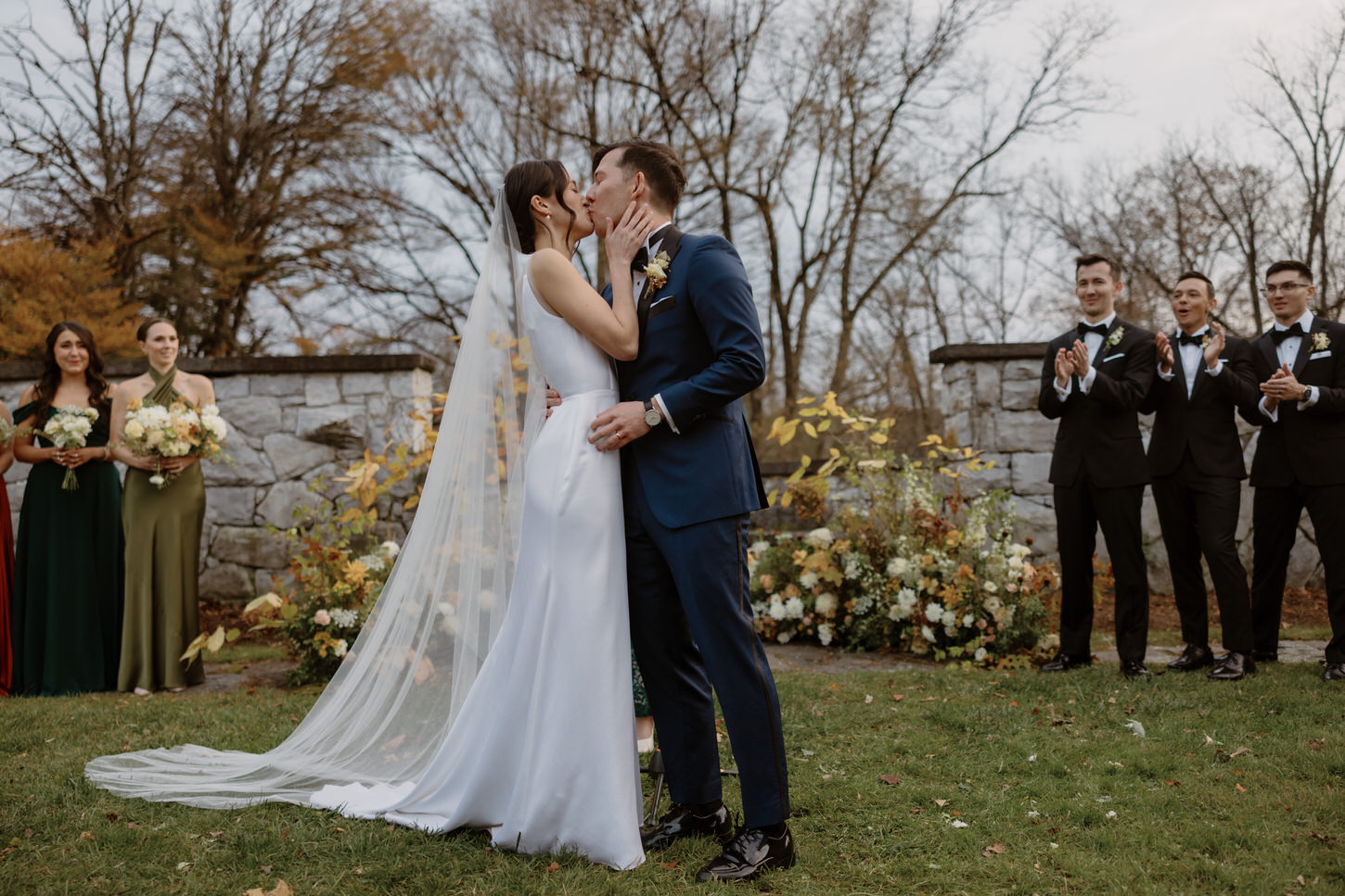 The newlyweds share their first kiss as husband and wife captured by Jenny Fu Studio NYC.