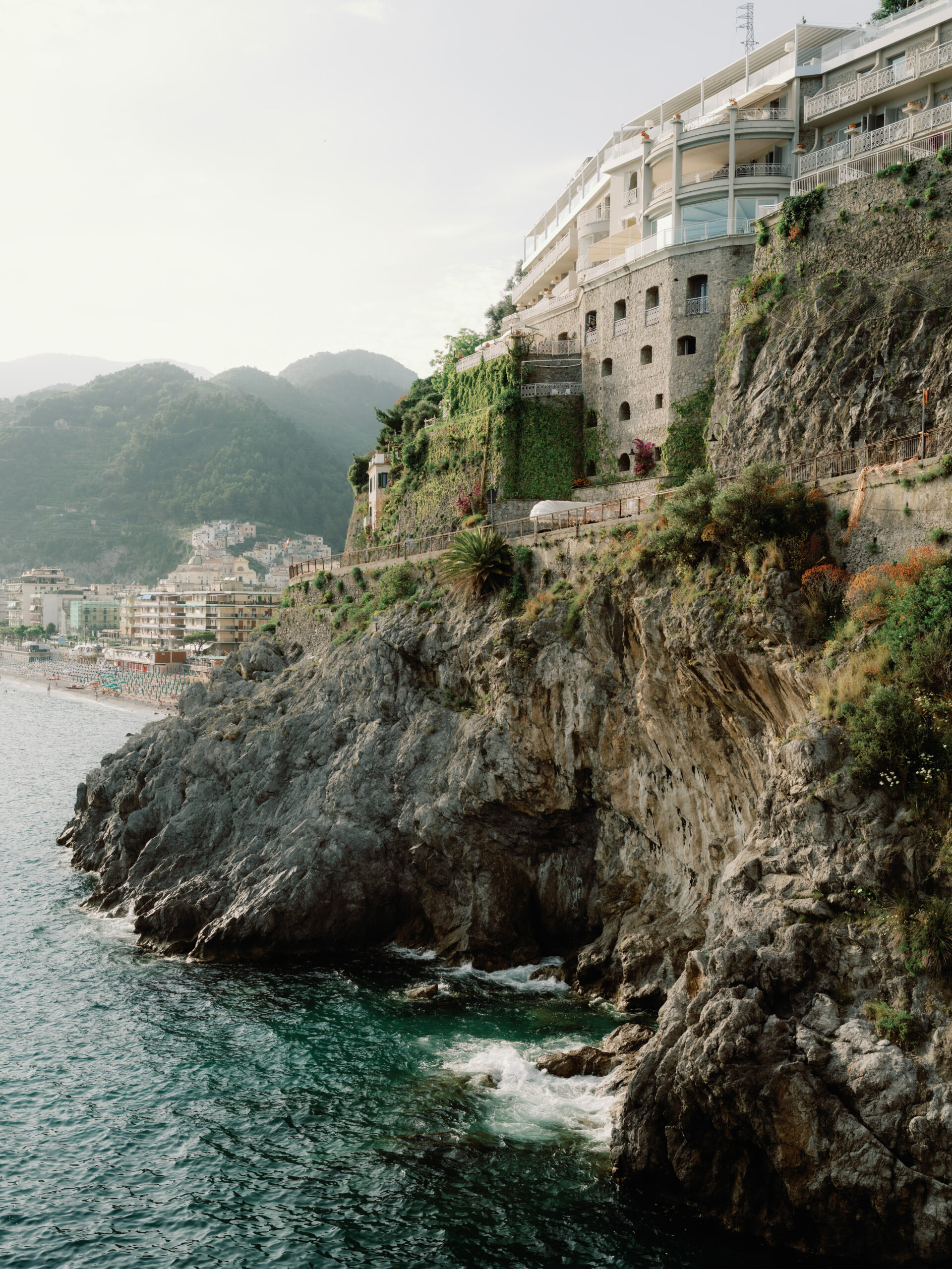 A beautiful view of a lake with villas on the shore at Ravello, Italy, shot by Jenny Fu Studio