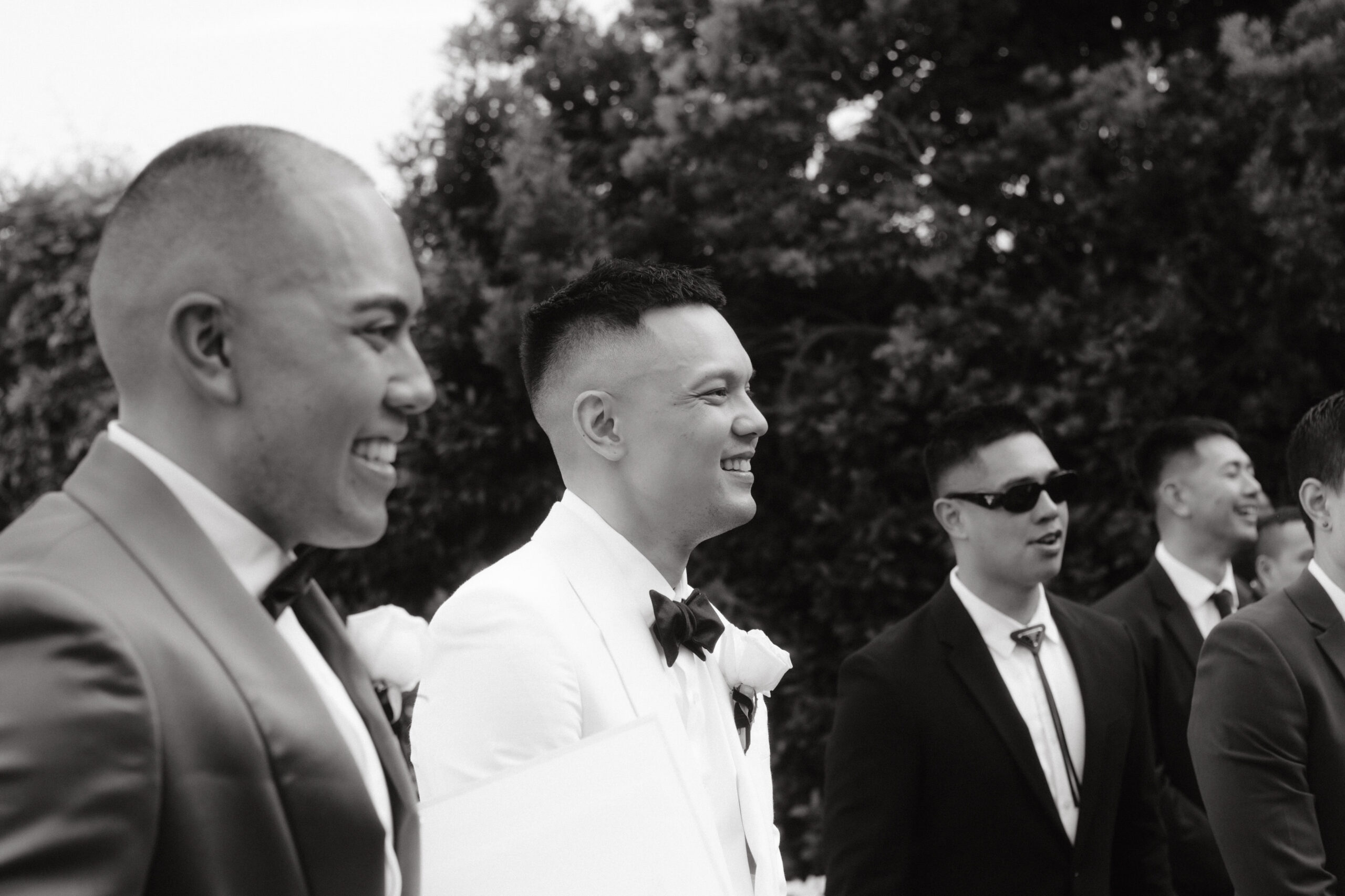 The groom and groomsmen excitedly await the bride, and it's candidly captured by Jenny Fu Studio