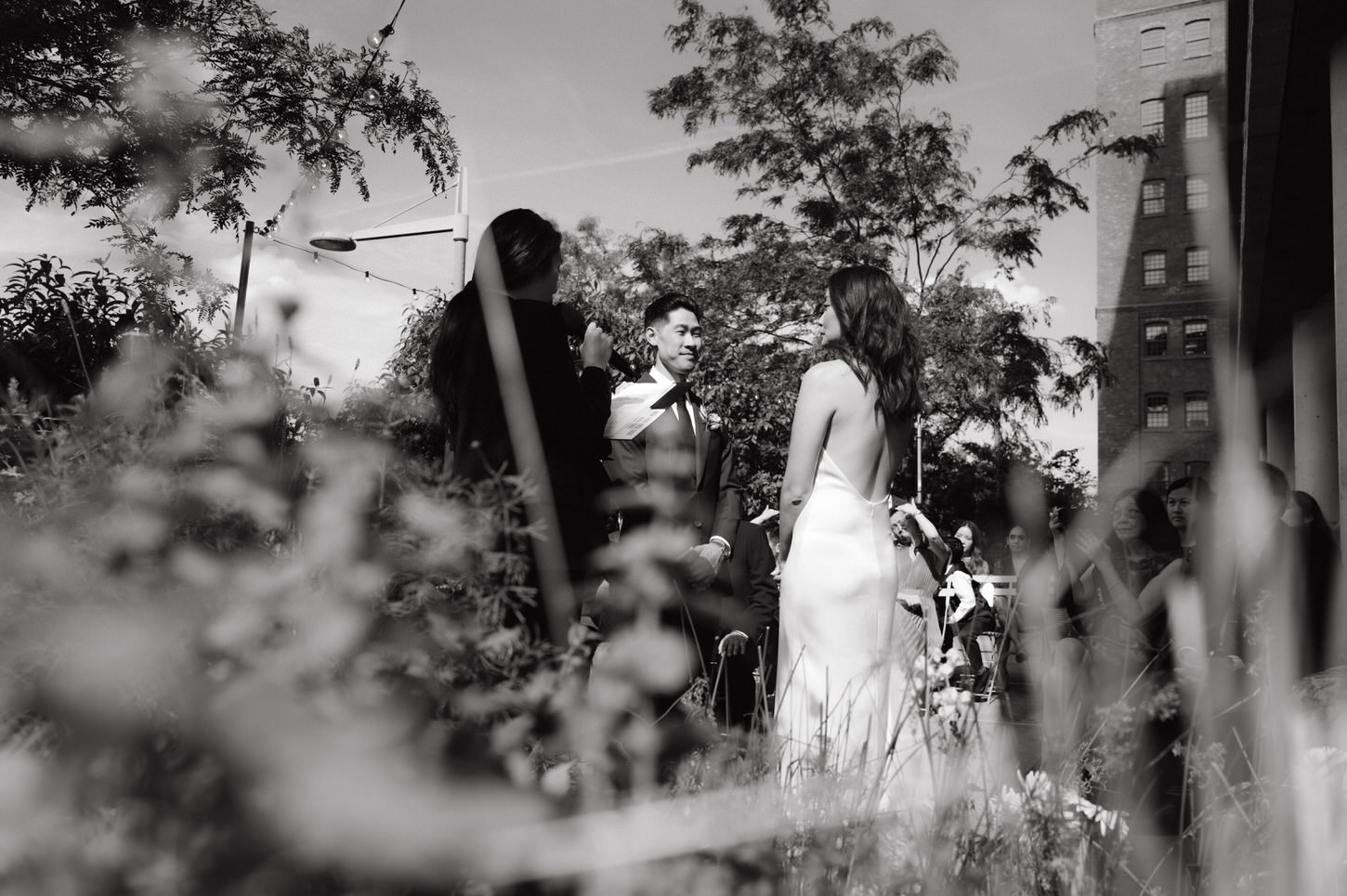 Black and white candid elopement ceremony image of the bride and groom in Celestine, NYC, captured by Jenny Fu Studio