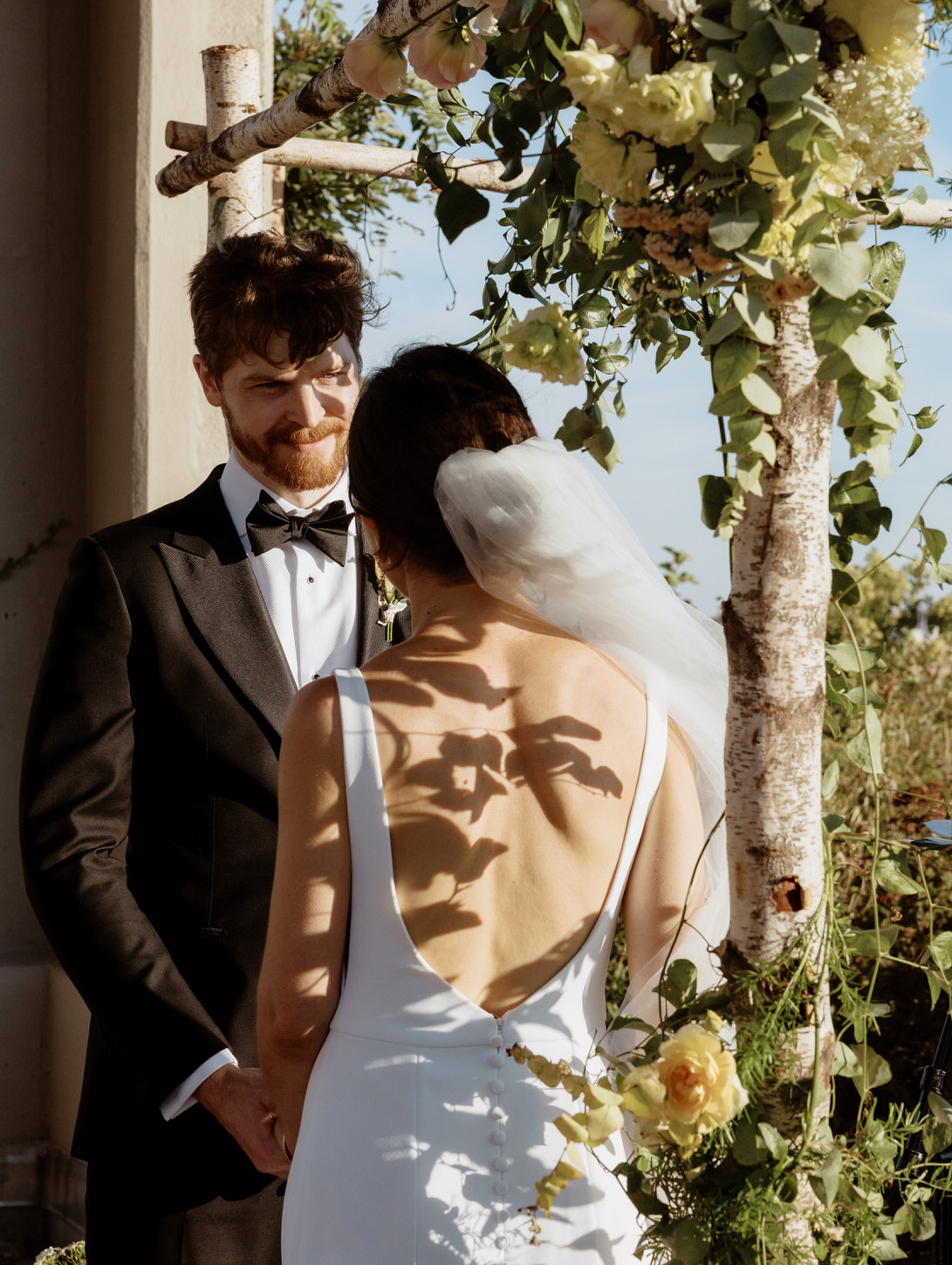 The groom is emotionally looking into the bride's eyes in the special wedding ceremony in New York shot by Jenny Fu Studio.