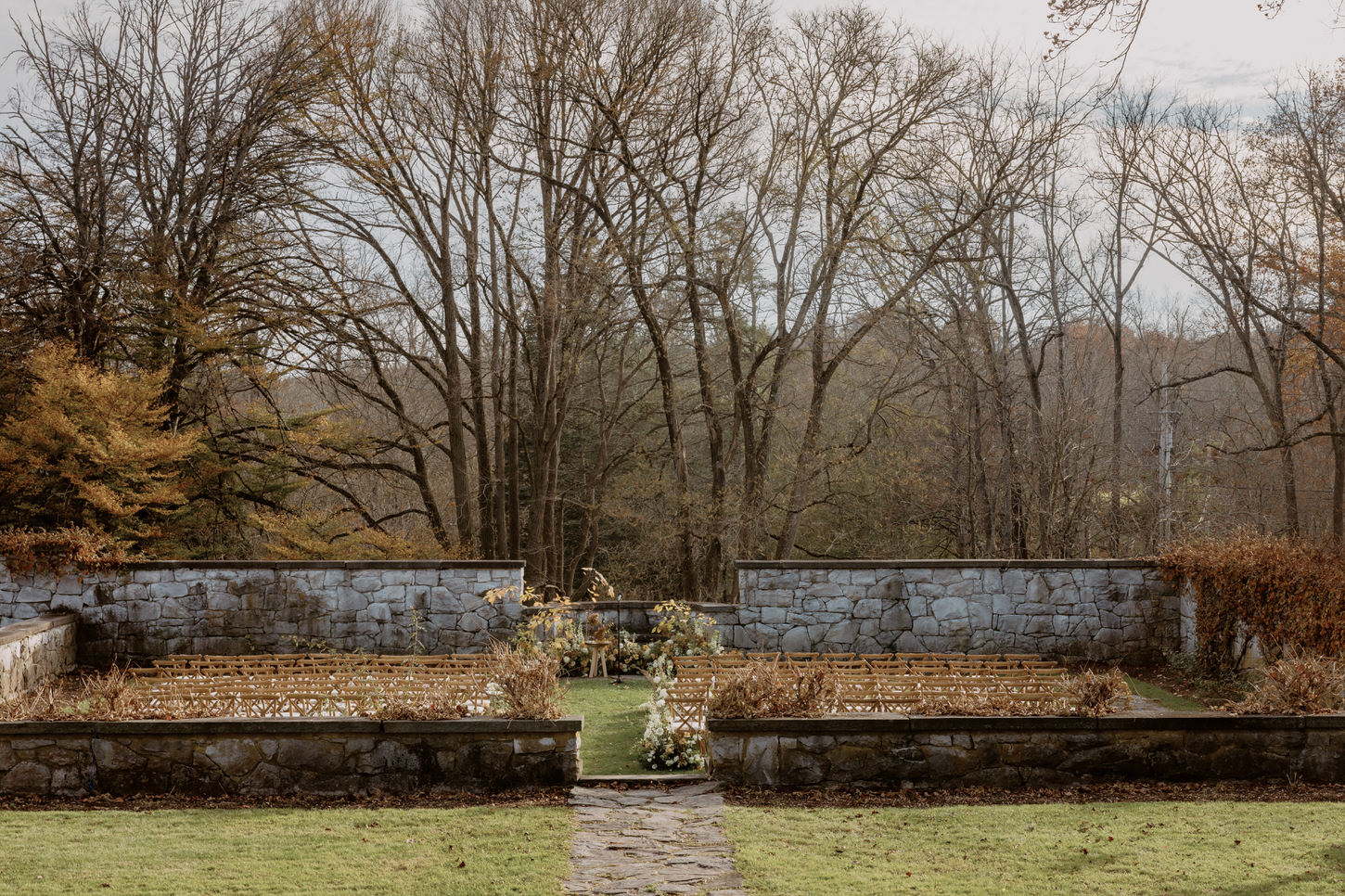 A lovely wedding ceremony venue with breathtaking landscape outdoors at Troutbeck, New York, captured by Jenny Fu Studio.