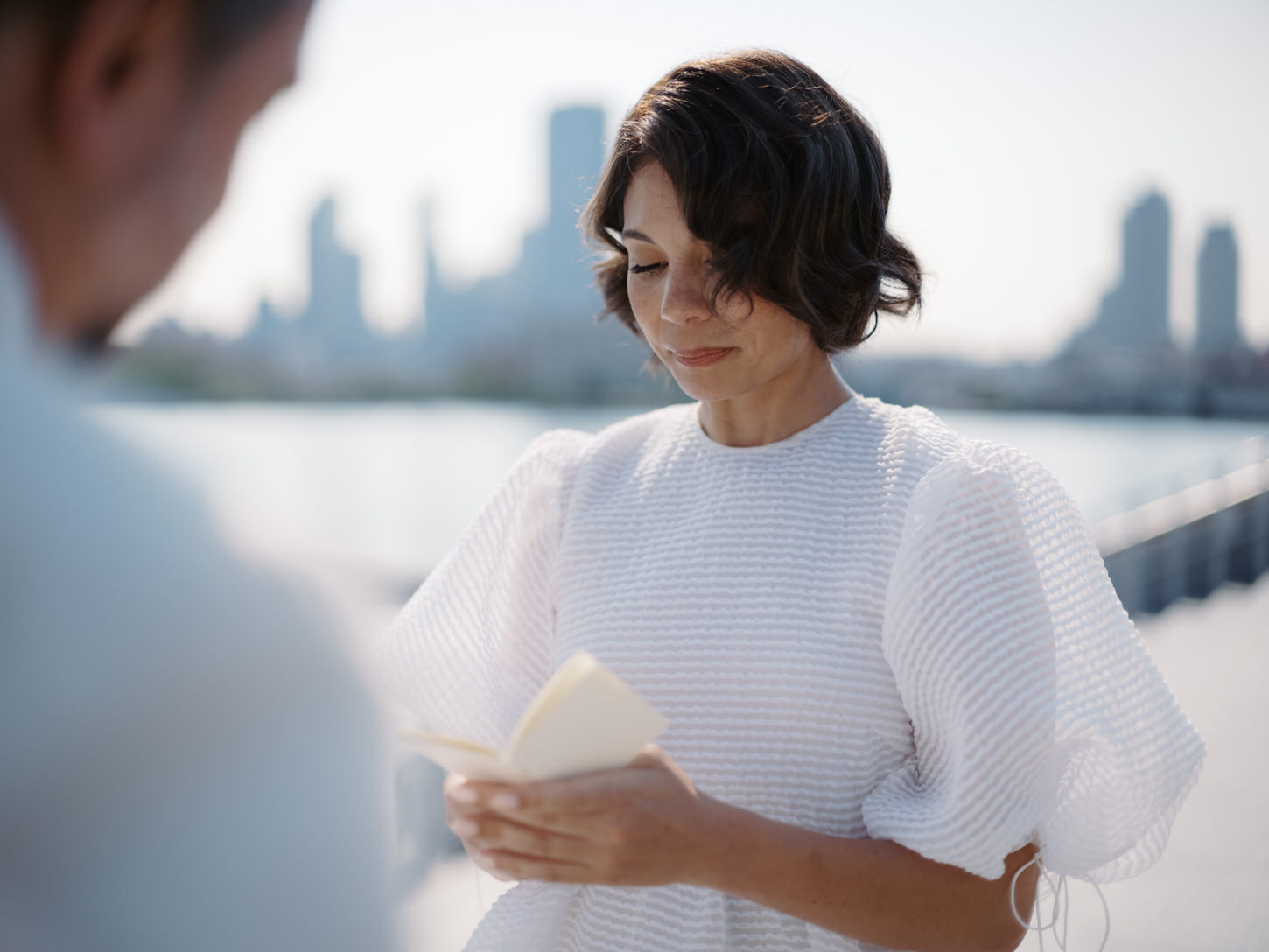 The bride emotional as she reads her vows to her groom, captured by Jenny Fu Studio.