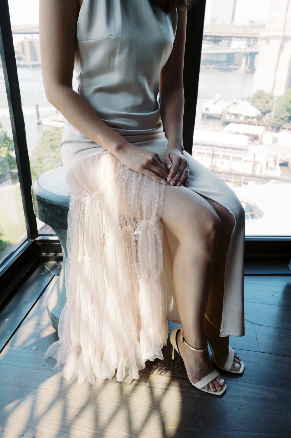 Close-up, lower body shot of the bride in her sleek wedding dress, for her elegant wedding captured by Jenny Fu Studio.