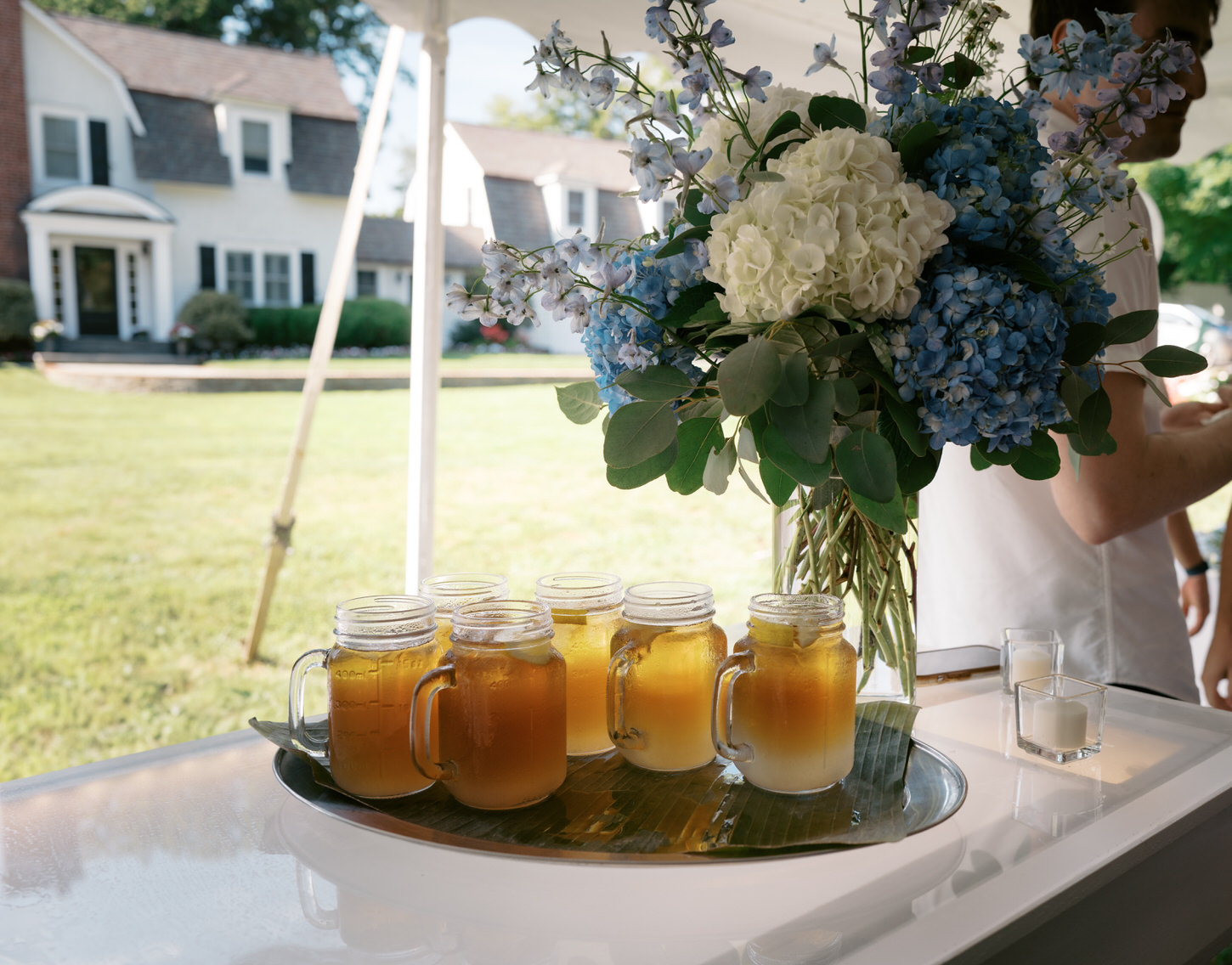 A still shot of cold drinks with powder blue and white flowers on a wedding shower captured by Jenny Fu Studio.