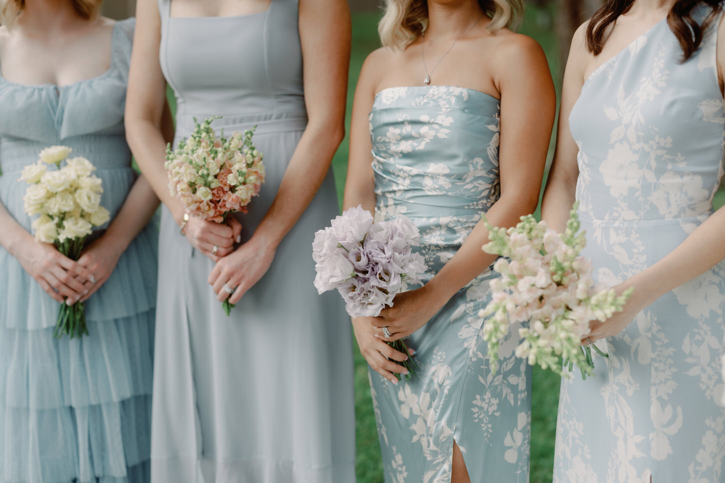 The bridesmaids are wearing powder blue mismatched dresses, holding different kinds of flowers in different pastel colors, shot by Jenny Fu Studio