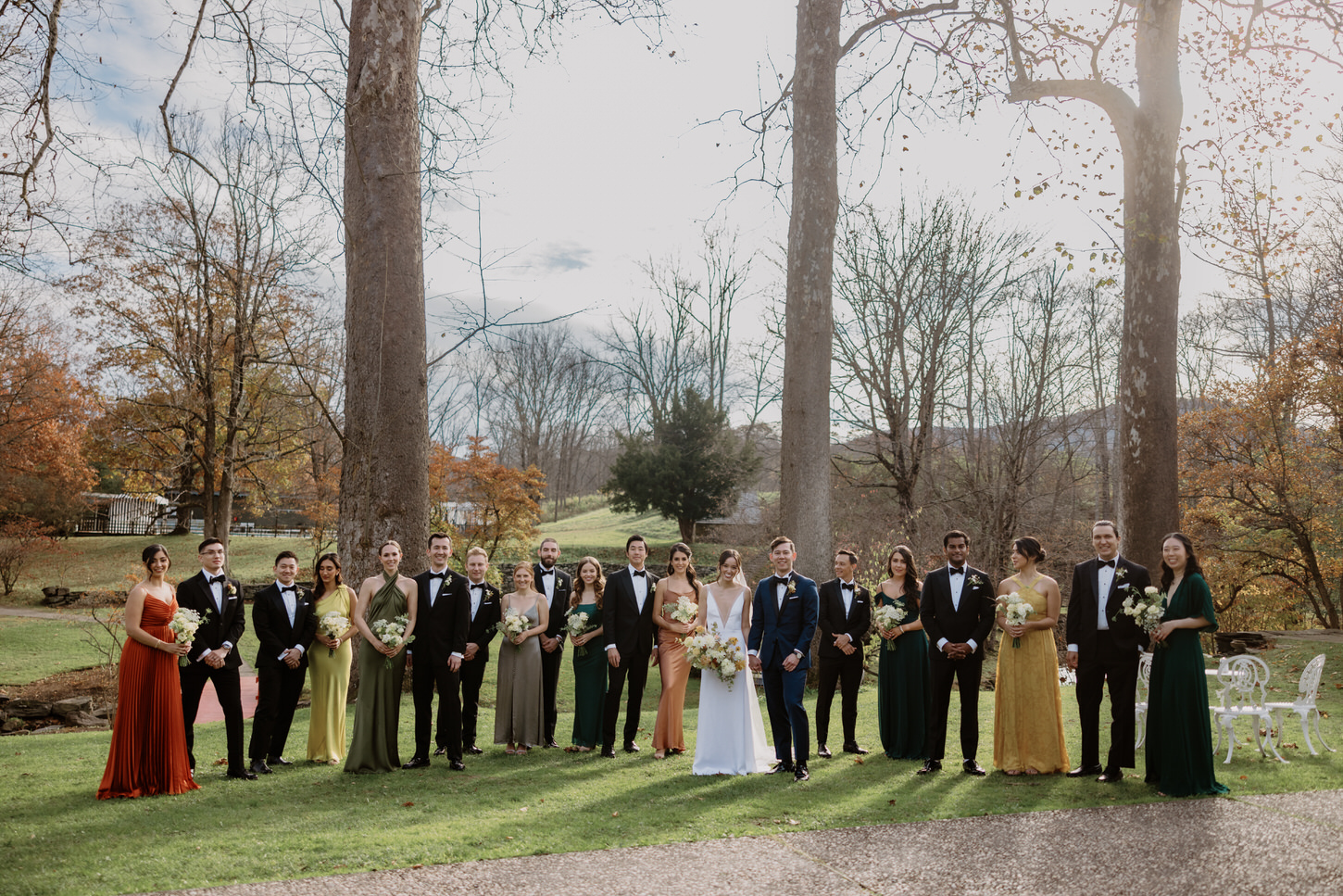 The bride and groom with their bridesmaids in fall color pallete and groomsmen in black tie, captured by Jenny Fu Studio