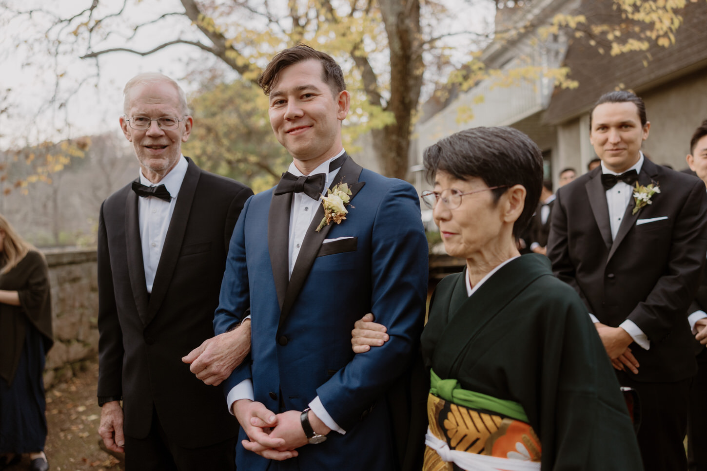 The groom is escorted by his father and Japanese mother, captured by Jenny Fu Studio.