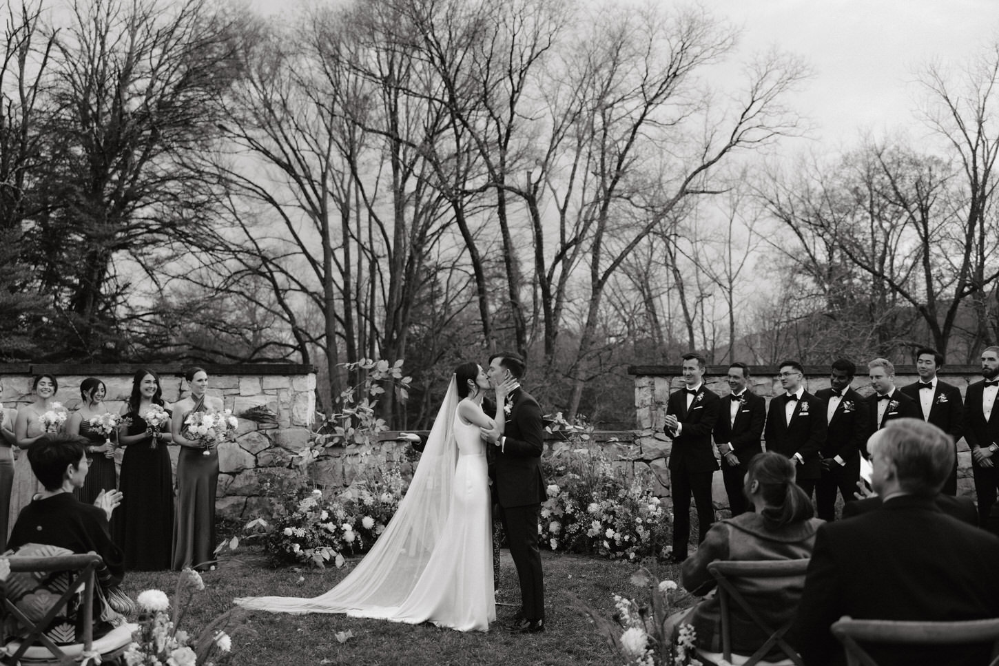 Black and white wedding ceremony image outdoors in Troutbeck, Amenia, NY, captured by Jenny Fu Studio.