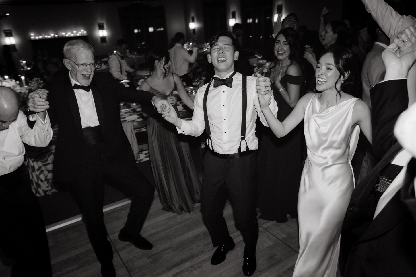 The bride, groom, family and friends are having a great time dancing the night away in Troutbeck, NY, candidly captured by Jenny Fu Studio.