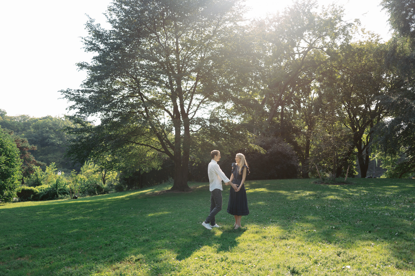 The engaged couple are having a timeless, sweet moment at Central Park, NYC, captured by Jenny Fu Studio.