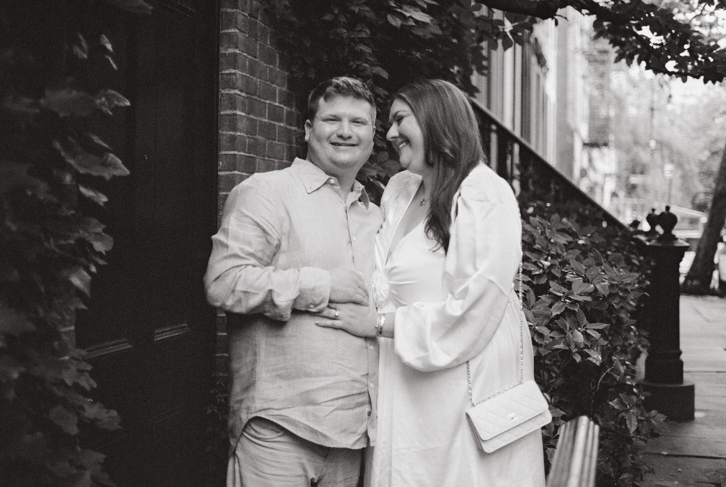 Black and white image of the engaged couple in West Village, NYC, captured by Jenny Fu Studio.