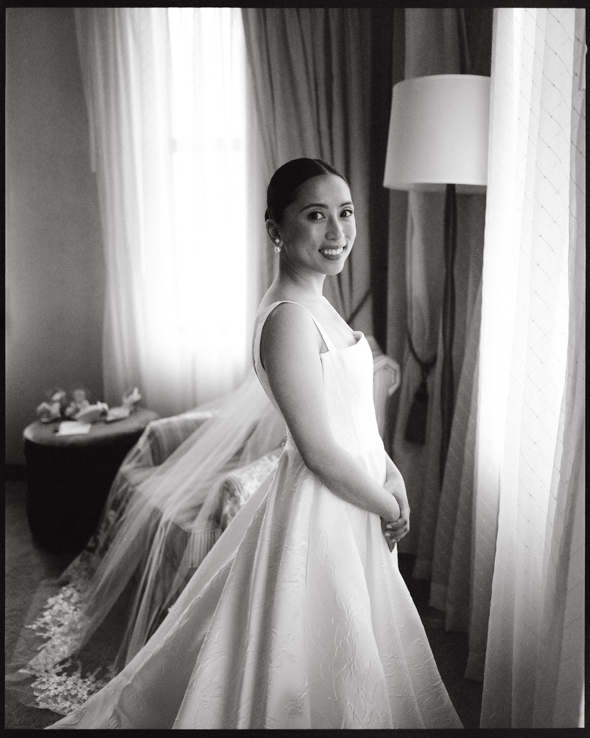 A beautiful getting-ready portrait of the bride captured on film by Jenny Fu Studio. 