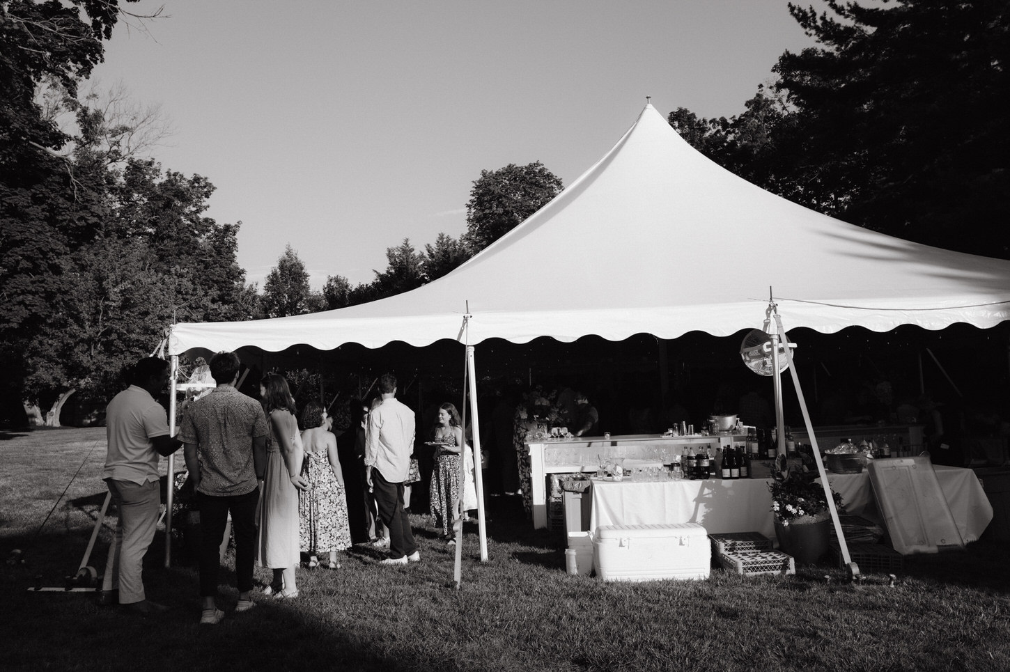 Black and white image of the guests lining up in an outdoor tent perfectly captured by Jenny Fu Studio.