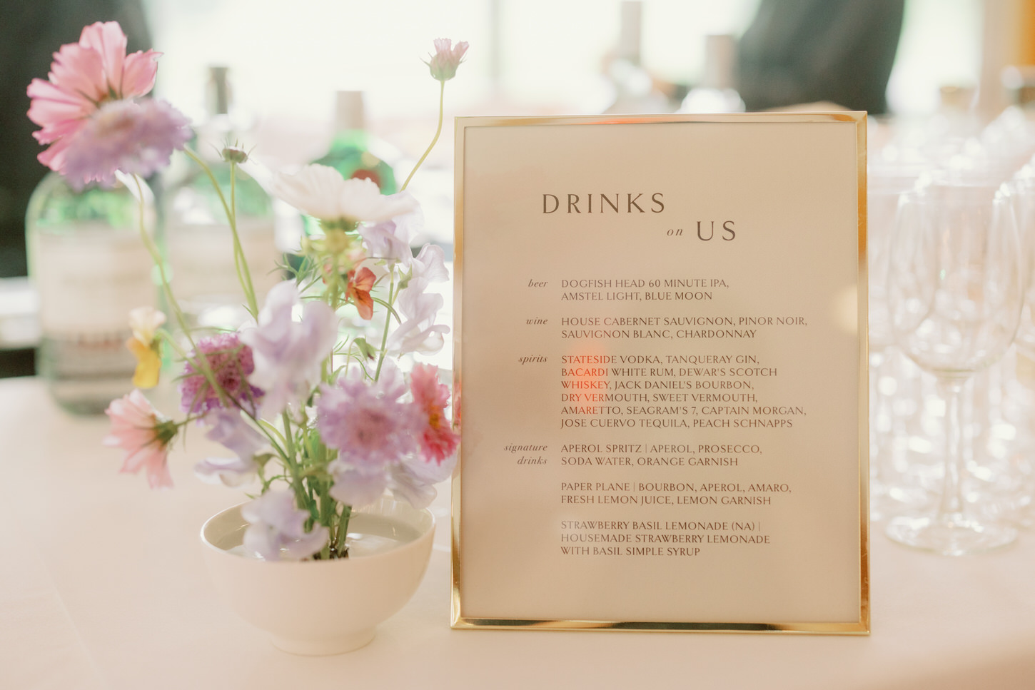 An image of the reception dining table, with pretty flowers, captured by Jenny Fu Studio.