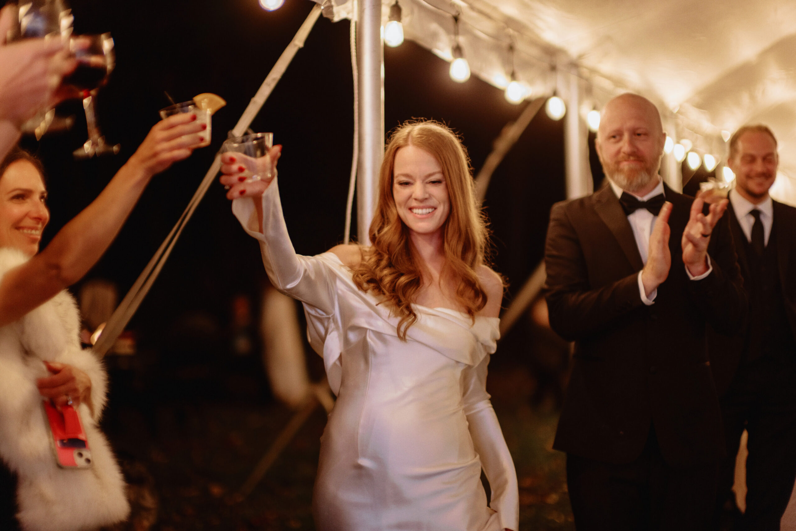 The bride and groom happily share a toast with the guests in their wedding reception, captured by Jenny Fu Studio.