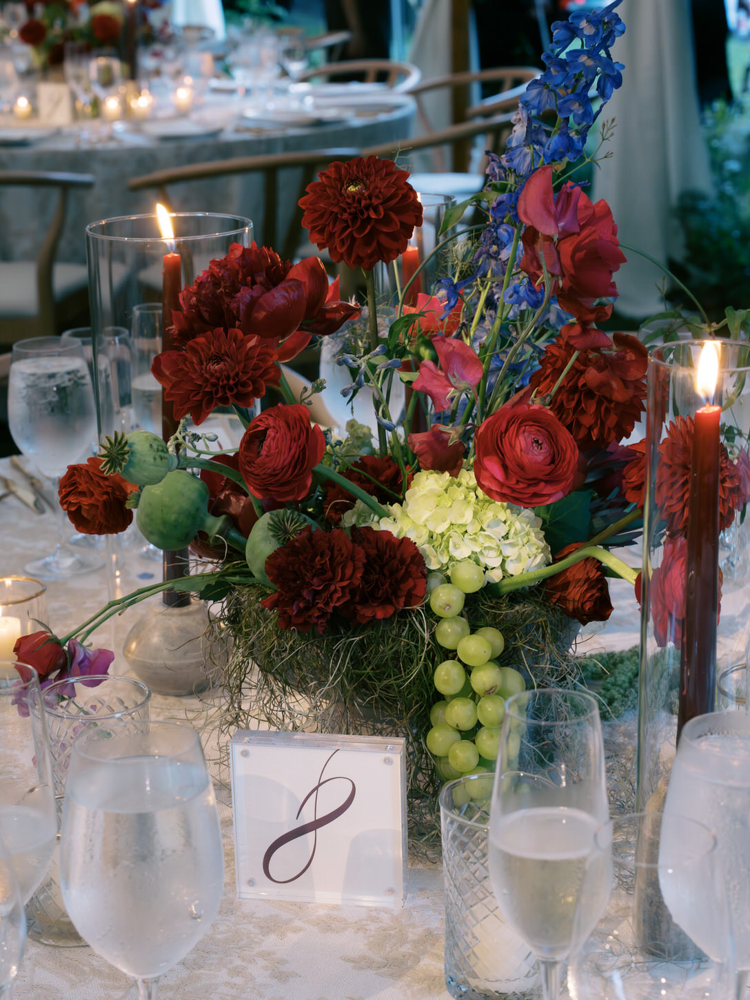 Beautiful flowers in red, maroon and white as table centerpiece in the upstate New York captured by Jenny Fu Studio.