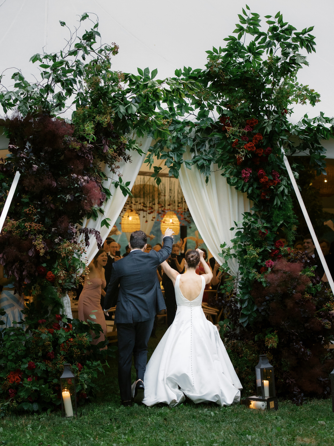 The newlyweds happily entered the wedding reception tent in the upstate New York, captured by Jenny Fu Studio.