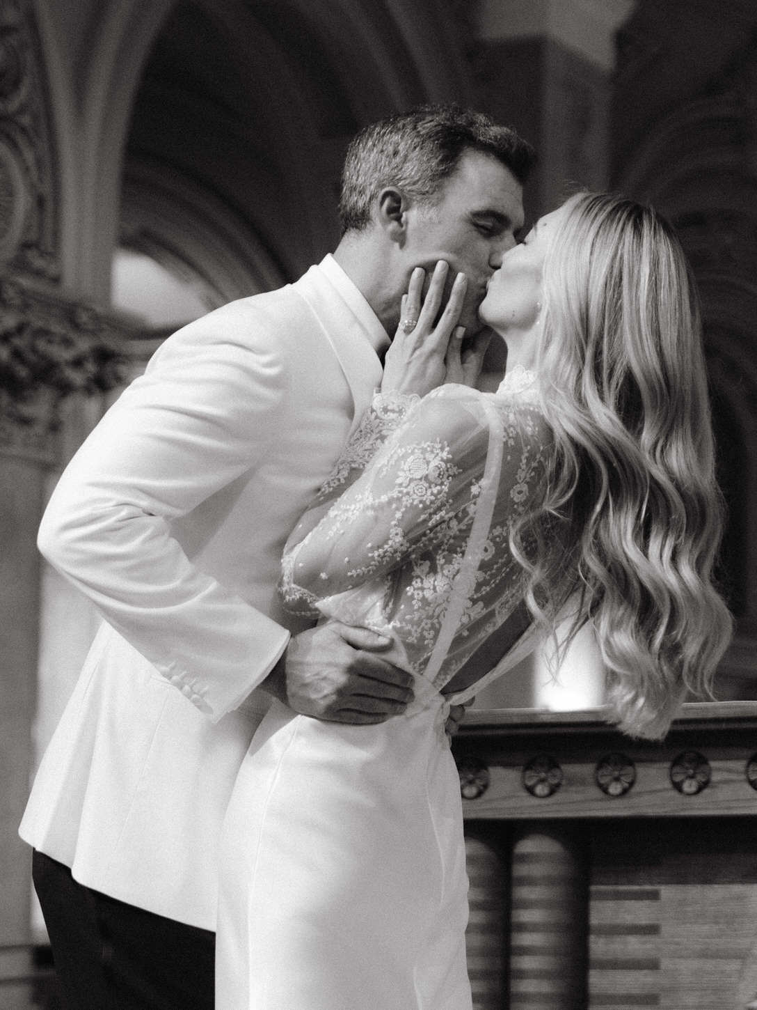 The newlyweds share their first kiss as husband and wife after the wedding ceremony, captured by Jenny Fu Studio