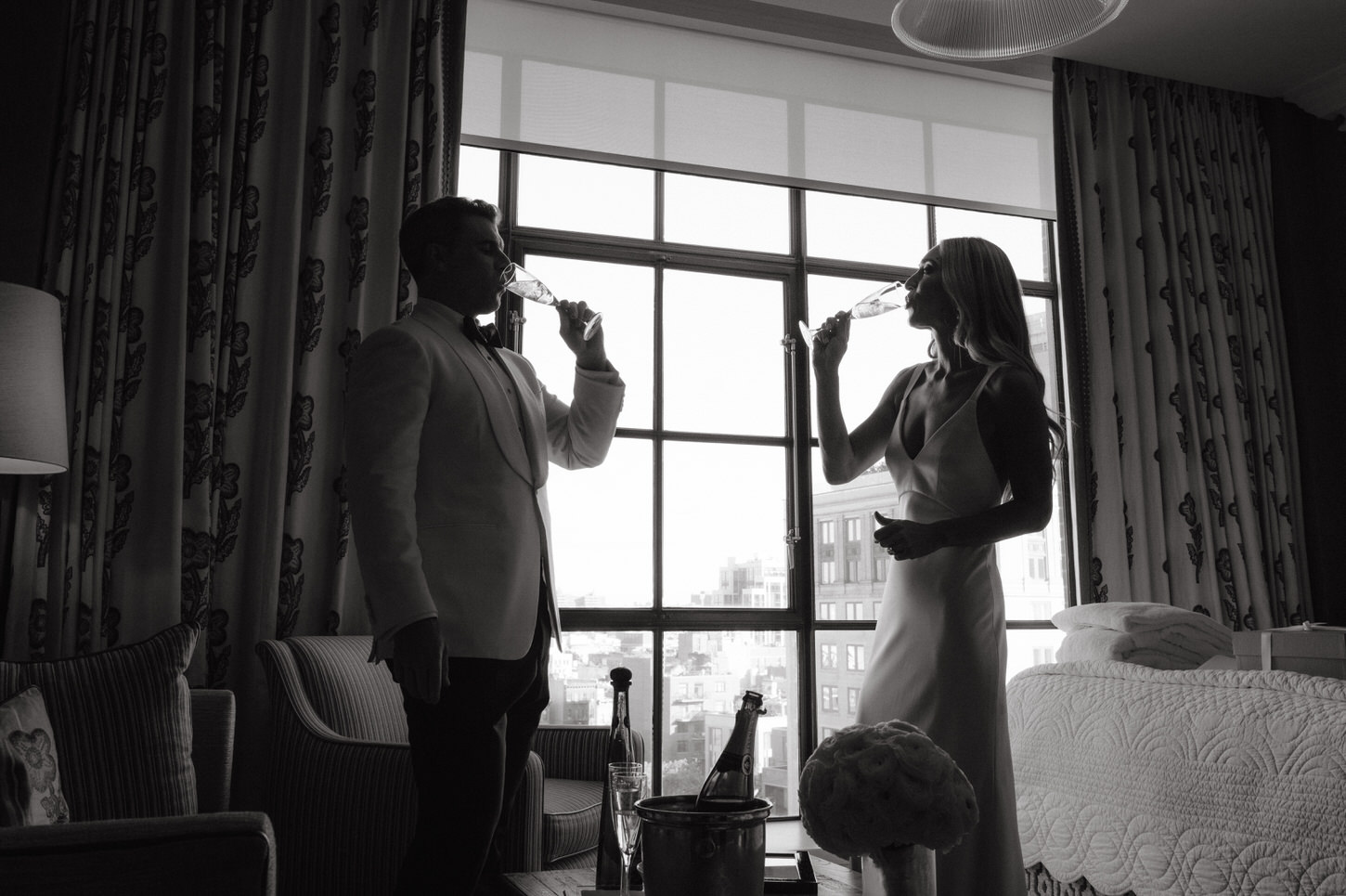 The newlyweds share an intimate toast before the wedding reception, captured by Jenny Fu Studio