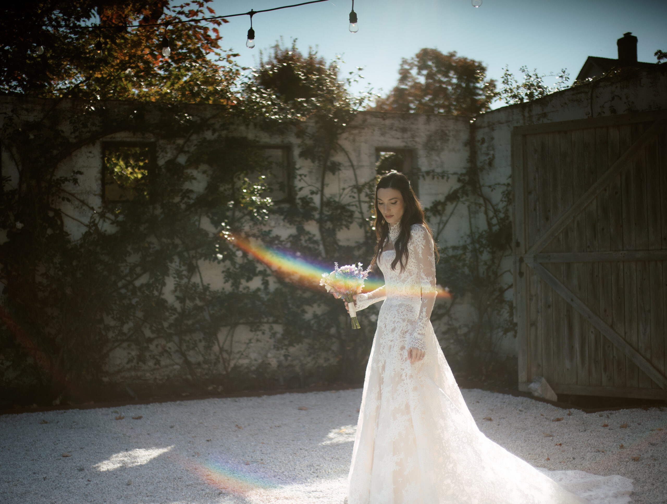 The bride is walking in a garden, captured in hybrid wedding photography by Jenny Fu Studio. 