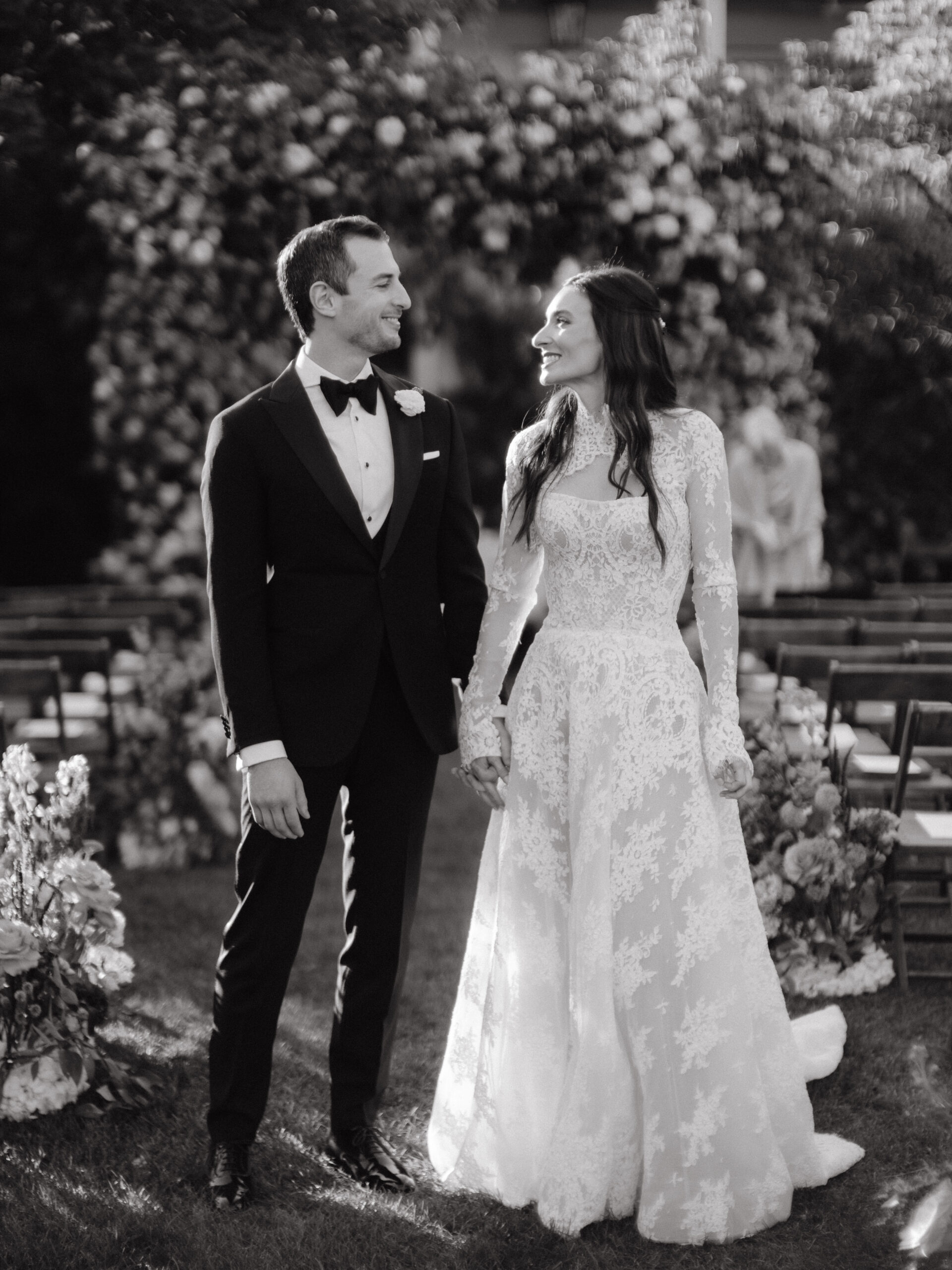 Black and white photo of the bride and groom in their garden wedding ceremony captured by Jenny Fu Studio.