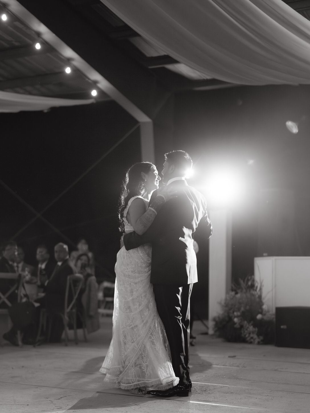 Black and white artistic wedding photo of the first dance, captured by Jenny Fu Studio.