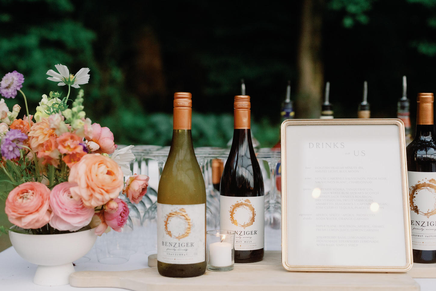 A vibrant elegant wedding portrait image of drinks and flowers in a wedding reception captured by Jenny Fu Studio.