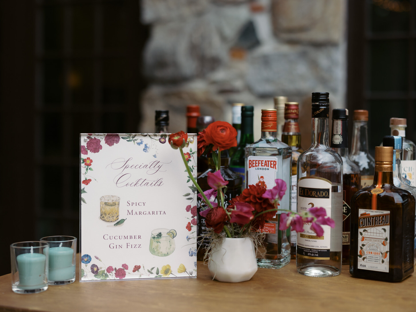 A bunch of drinks at a bar in a wedding reception captured by Jenny Fu Studio.