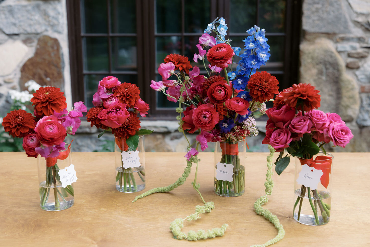 Bunches of flowers in red and pink tones for a wedding in the Upstate New York, captured by Jenny Fu Studio.